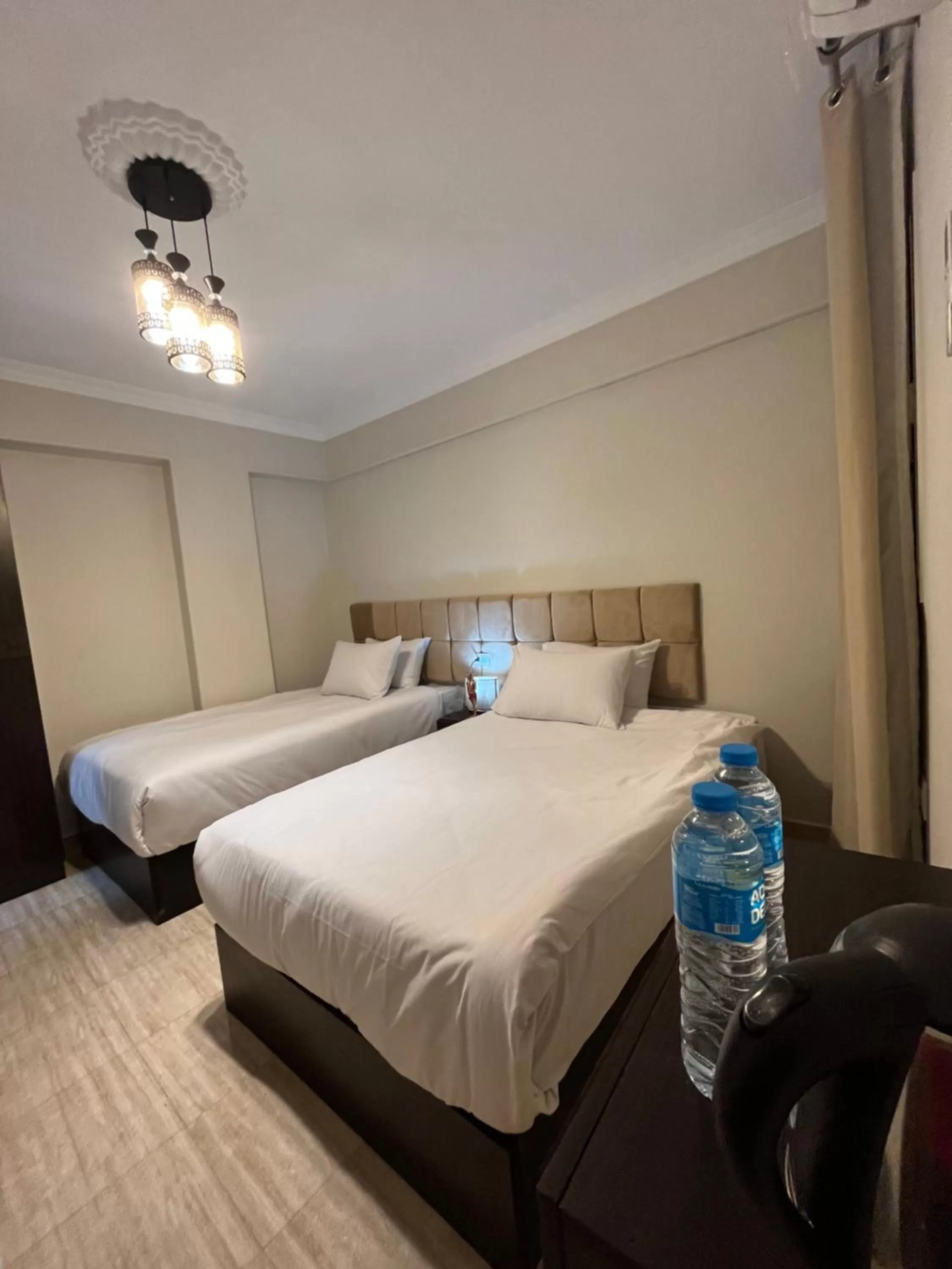 Bed in Crowne Pyramids view inn