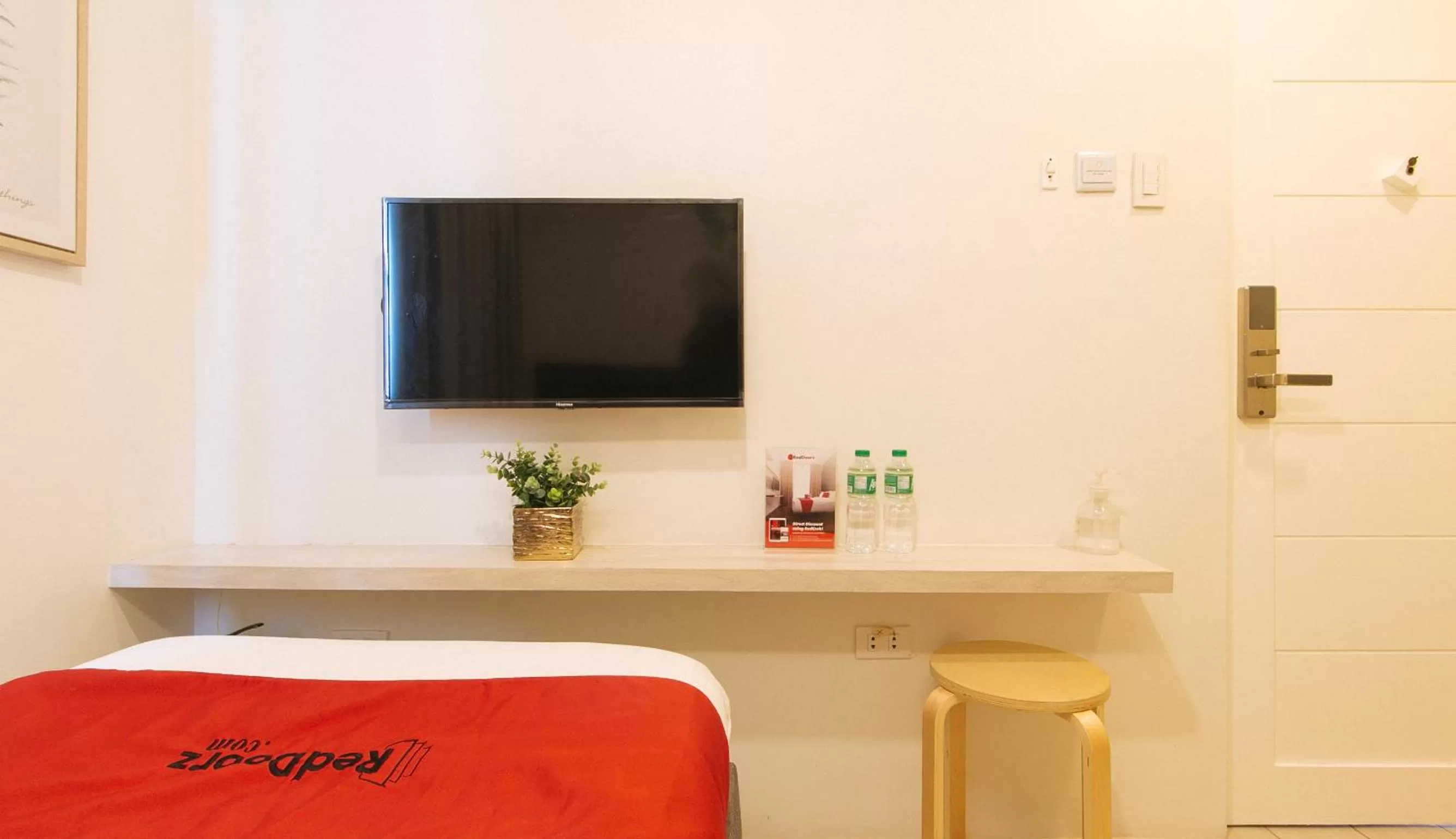 TV and multimedia in RedDoorz Plus at La Belle Residences Makati City