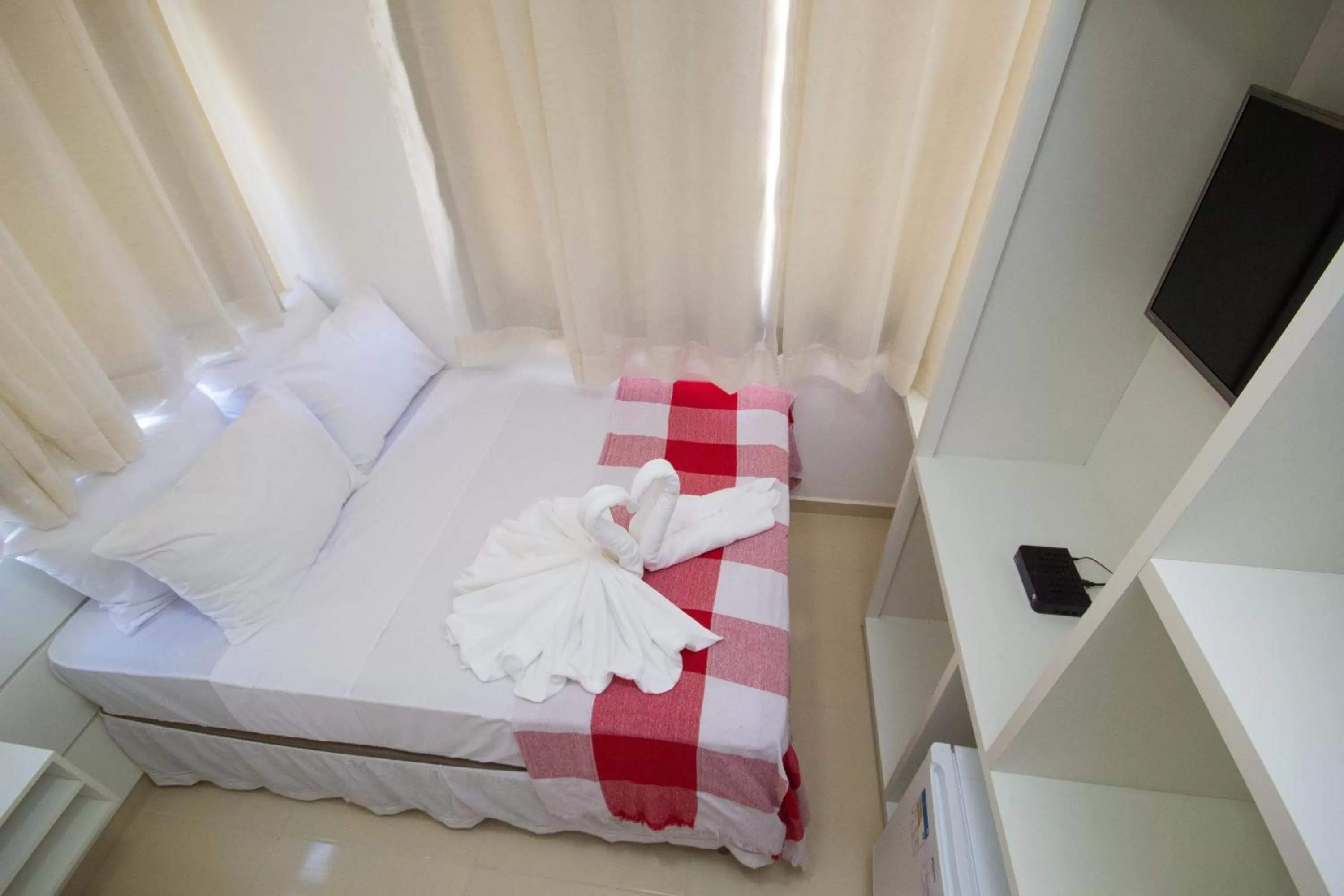 Bed in Pousada Kanoas