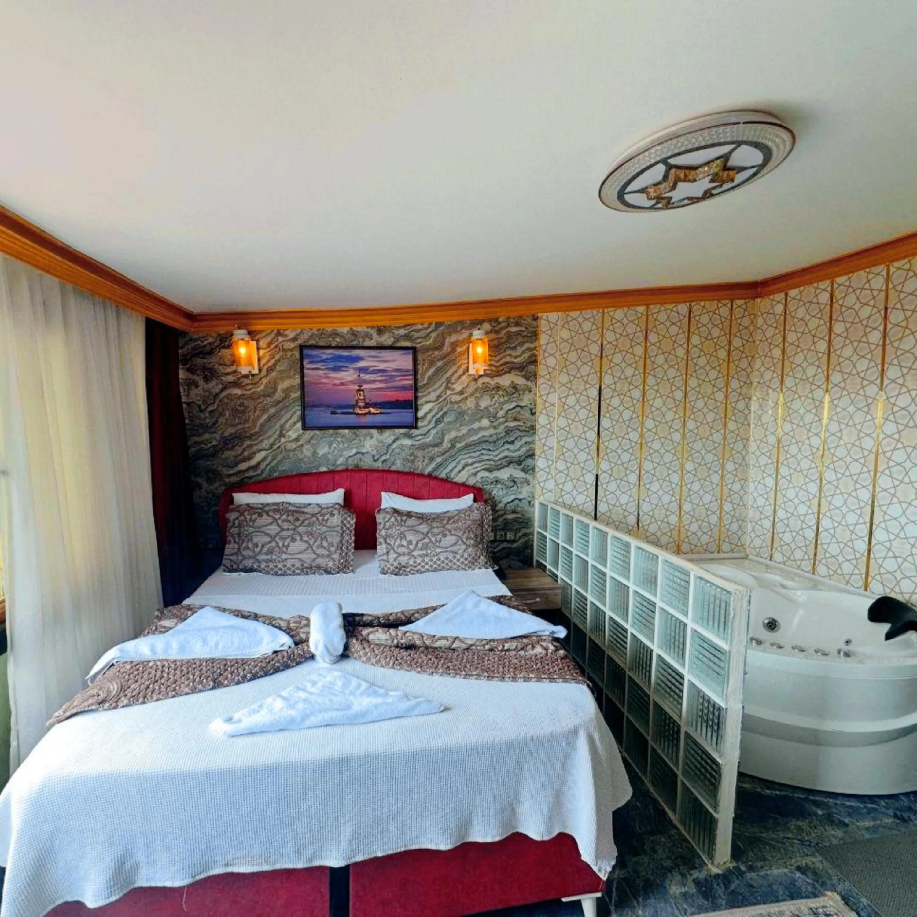 Bed in Royal Gur Hotel