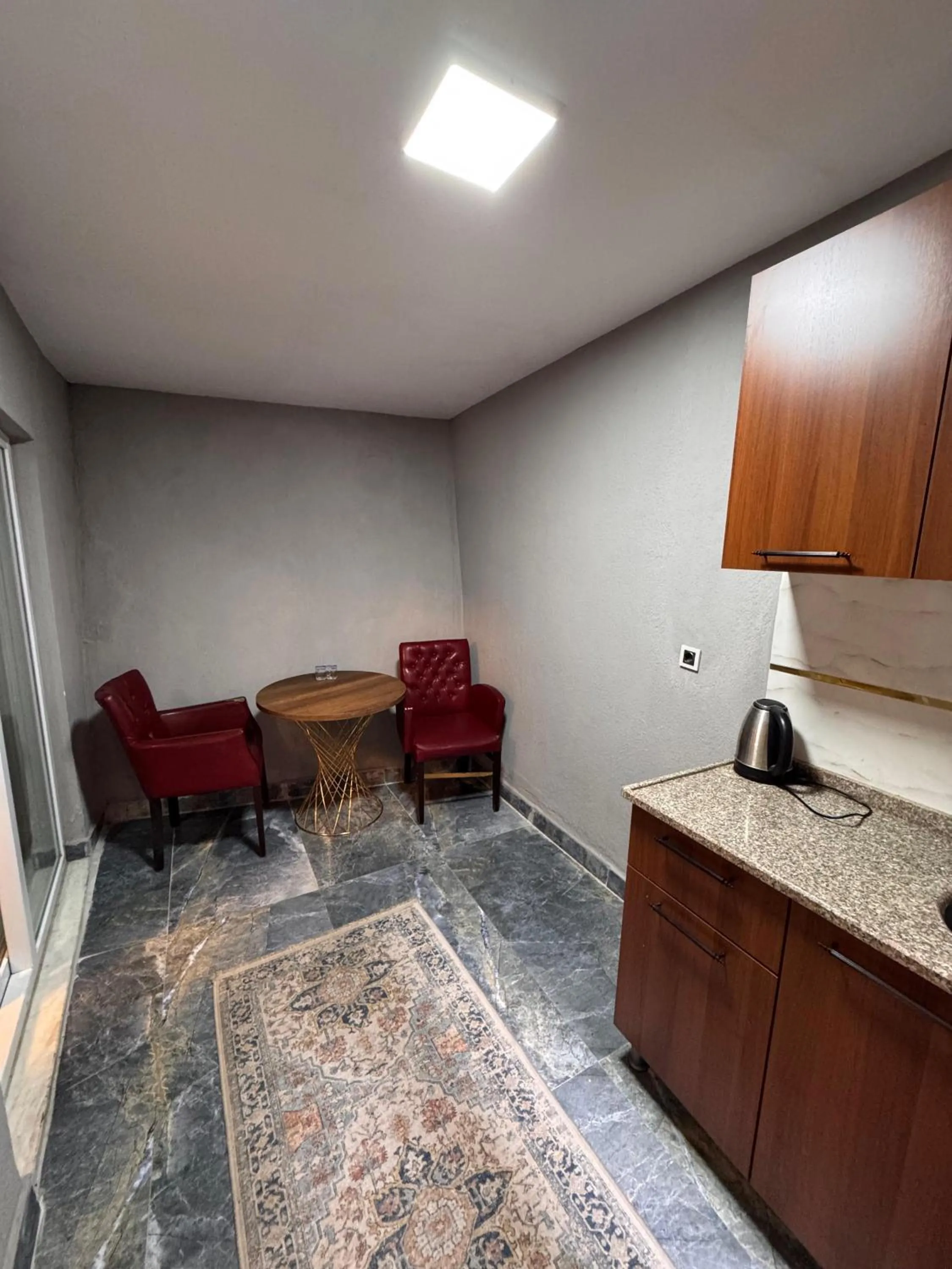 Kitchen or kitchenette in Royal Gur Hotel