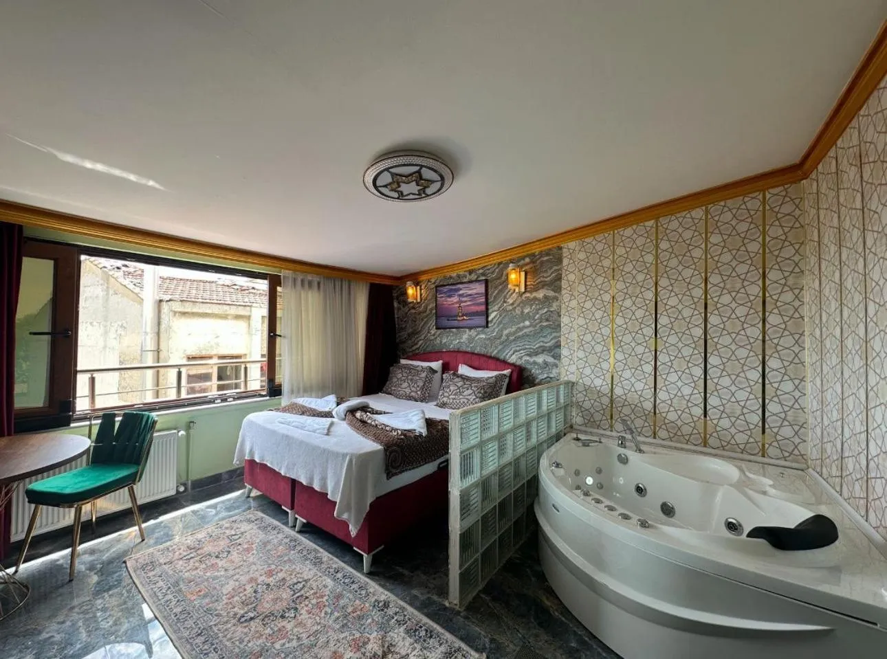 Bed in Royal Gur Hotel