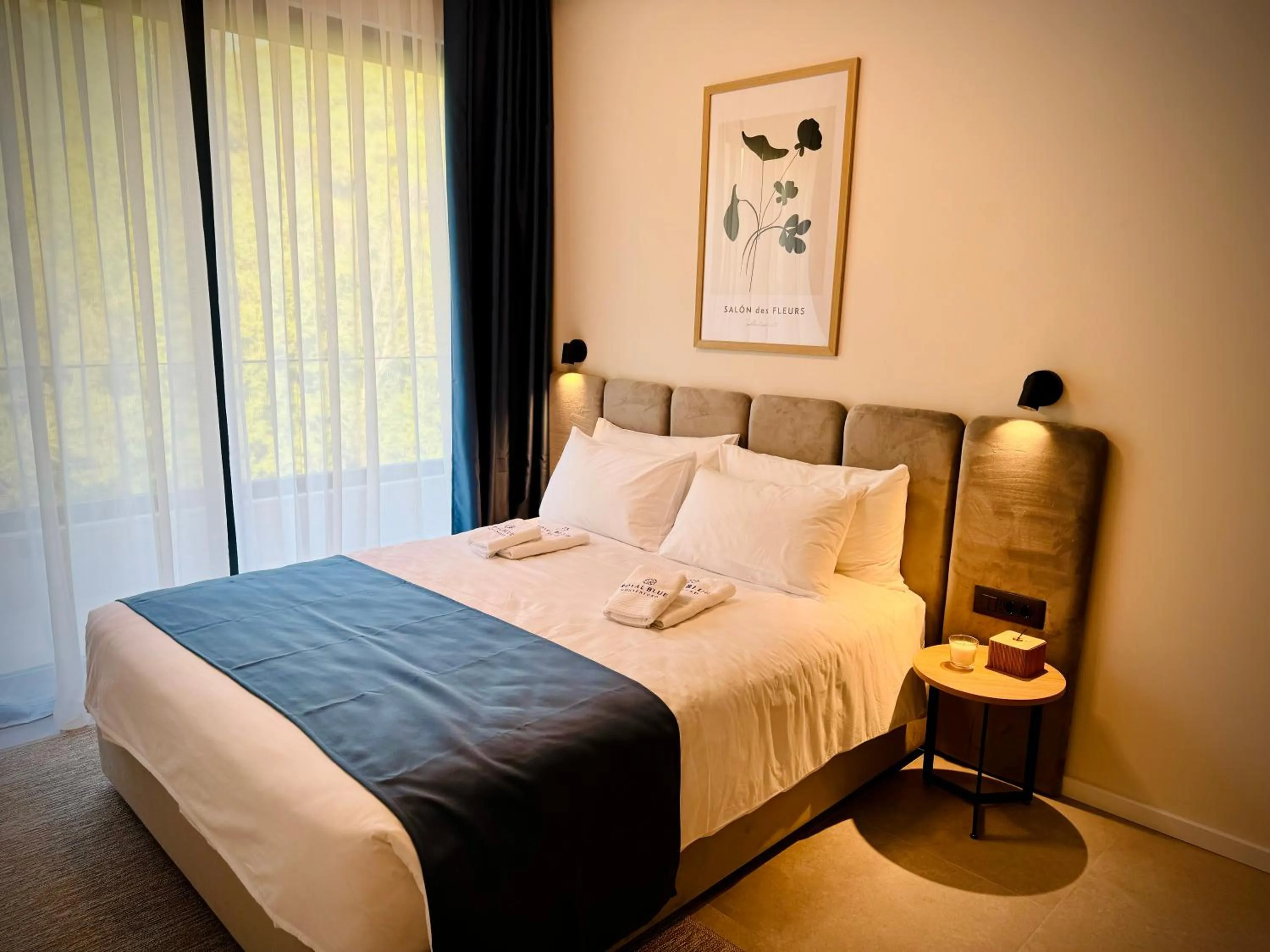 Bed in Royal Blue Resort & Residences