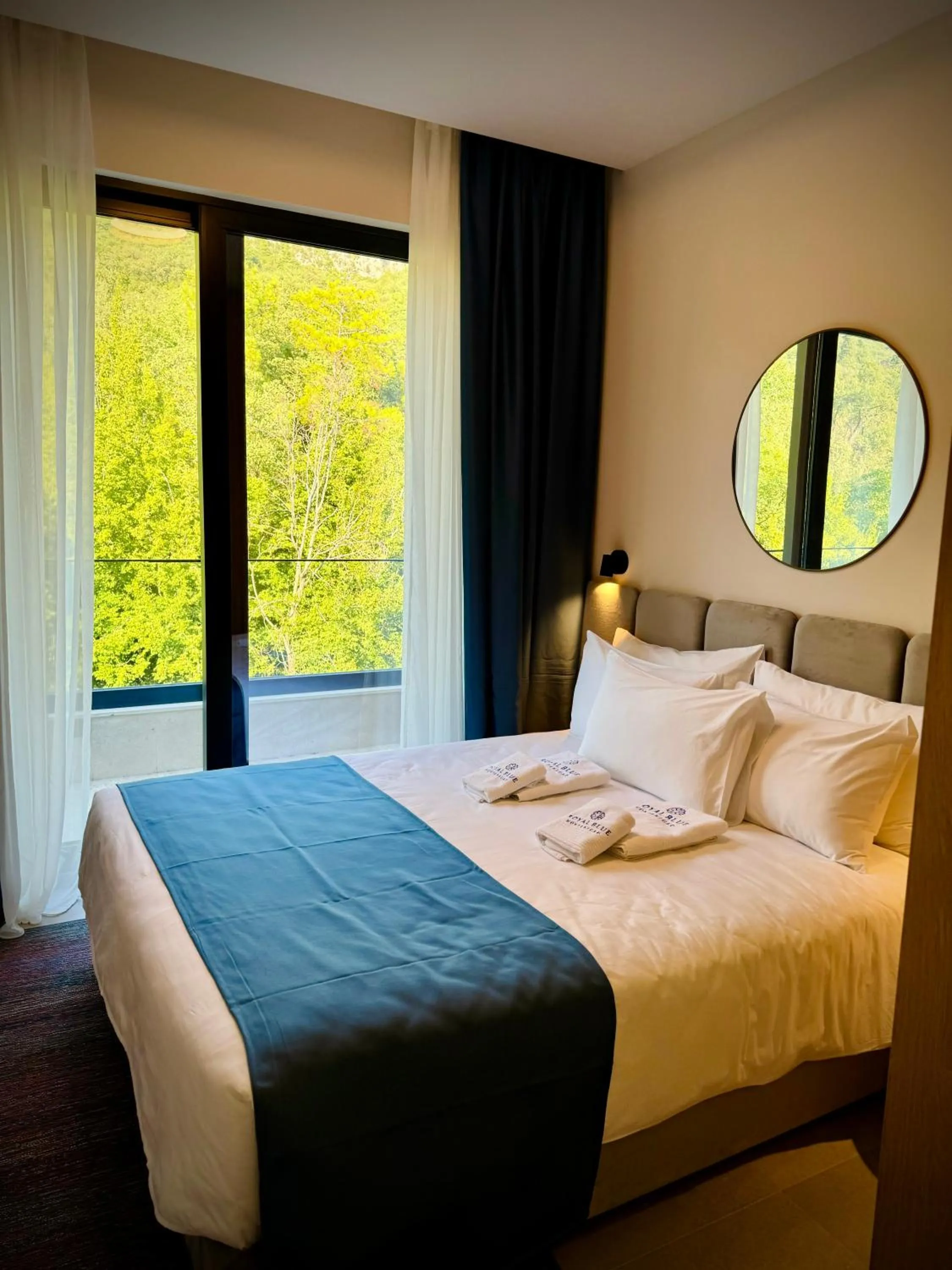 Bed in Royal Blue Resort & Residences