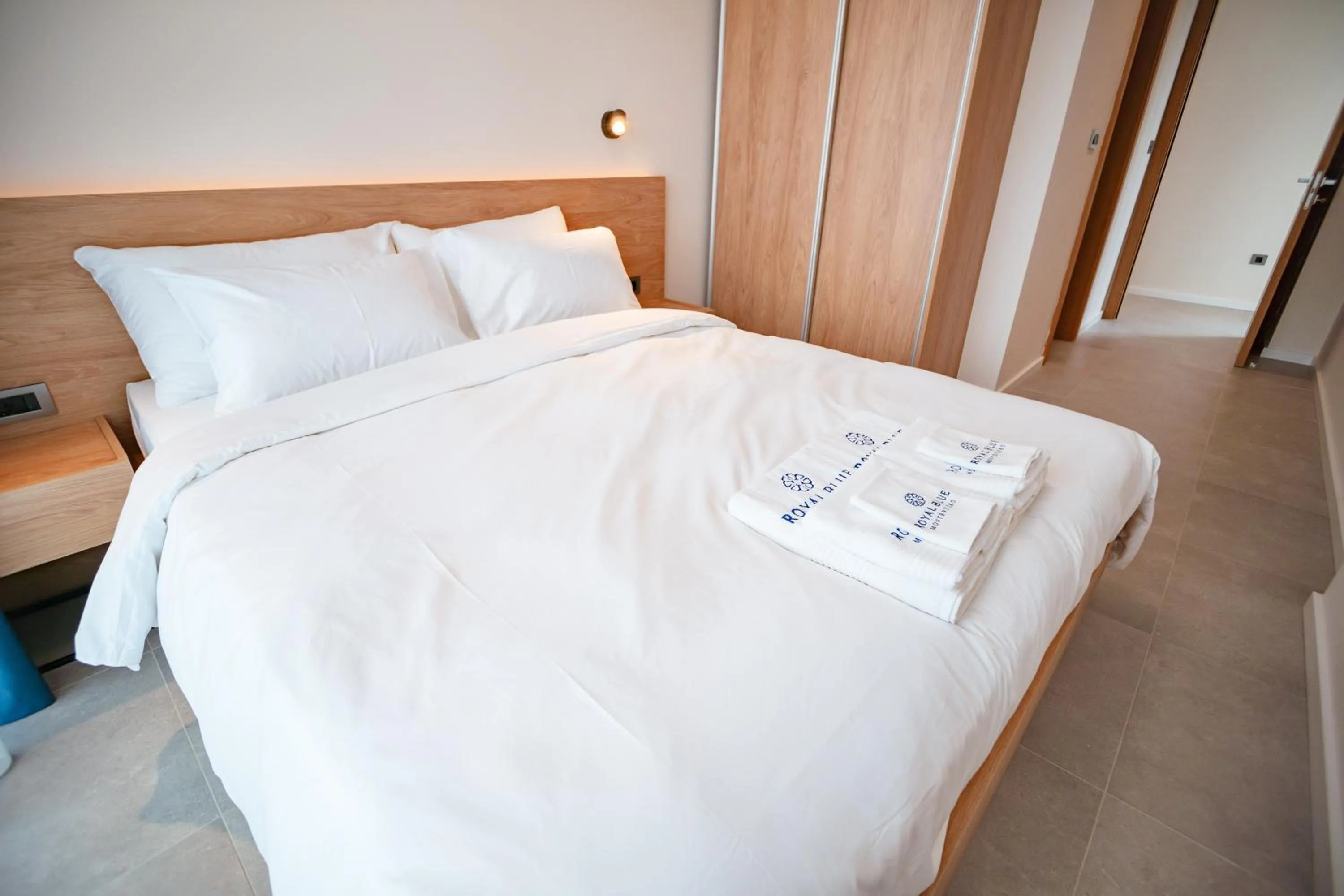 Bed in Royal Blue Resort & Residences