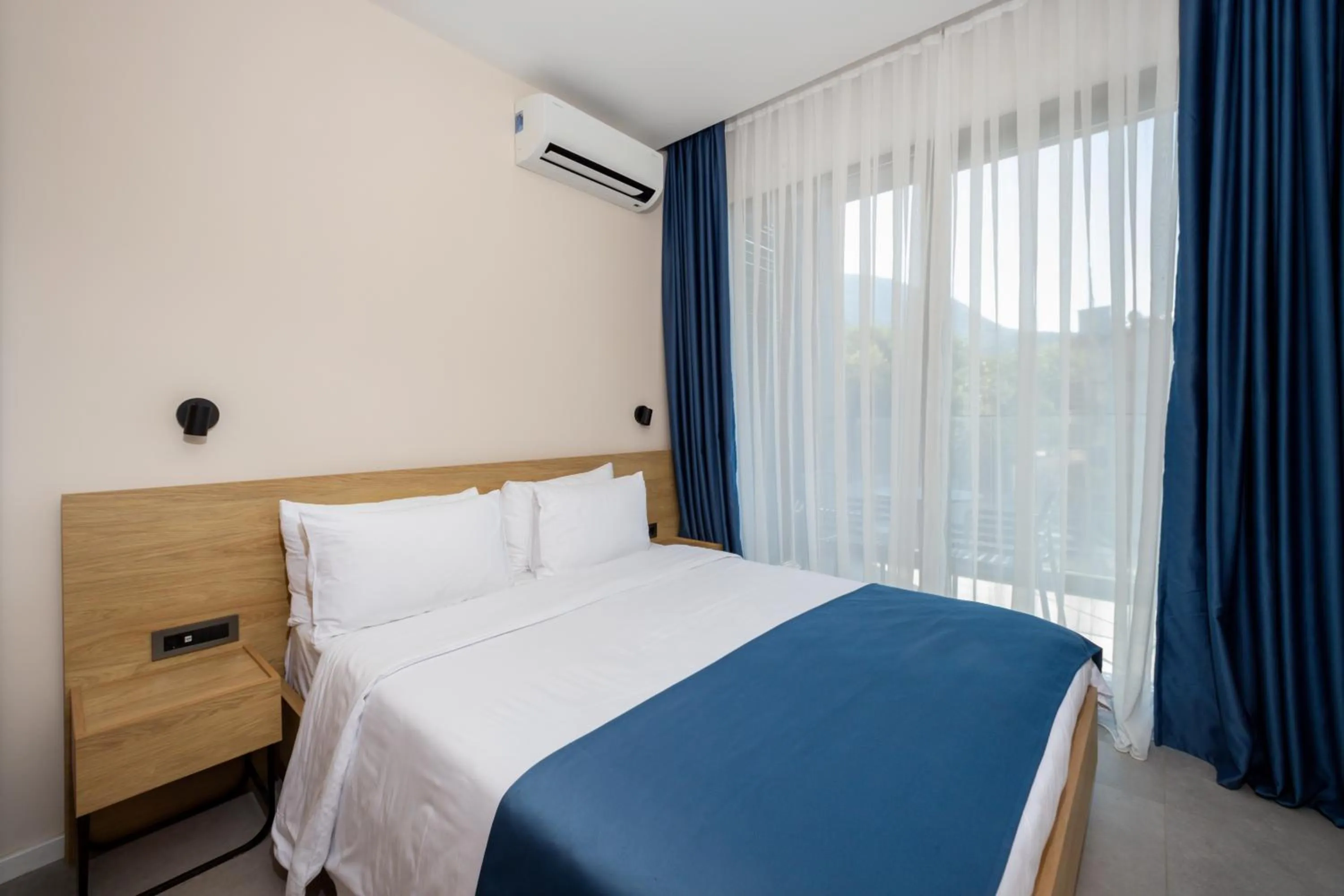 Bed in Royal Blue Resort & Residences