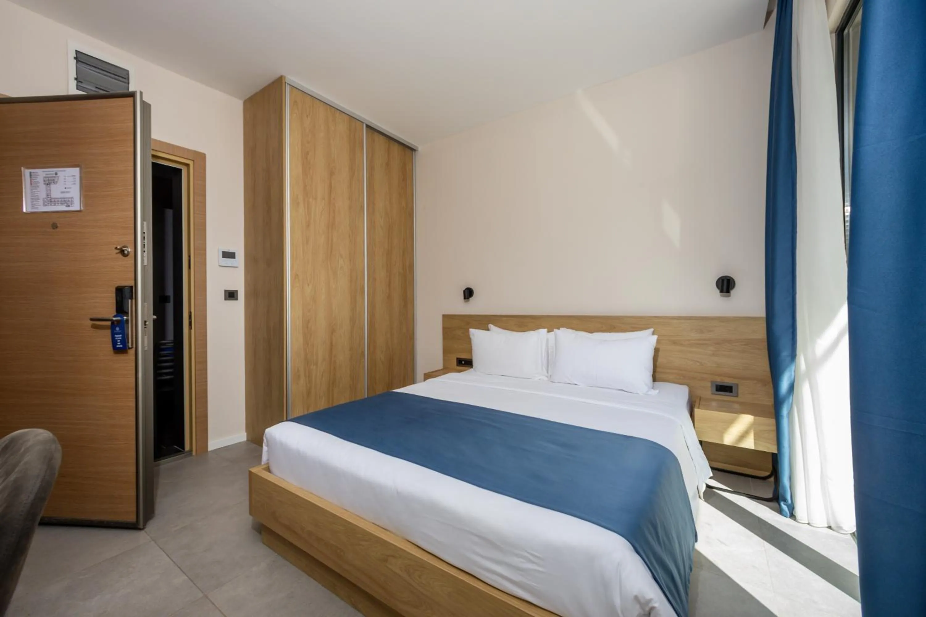 Bed in Royal Blue Resort & Residences