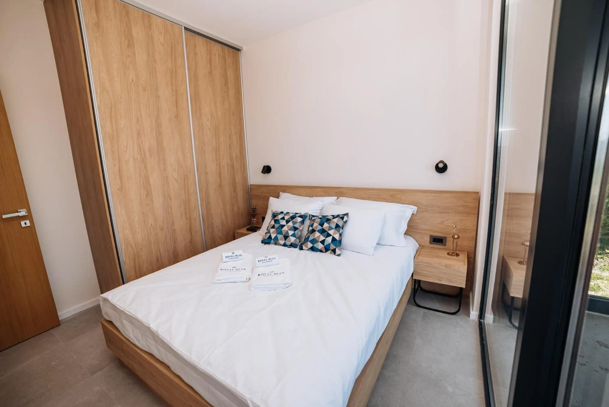 Bed in Royal Blue Resort & Residences