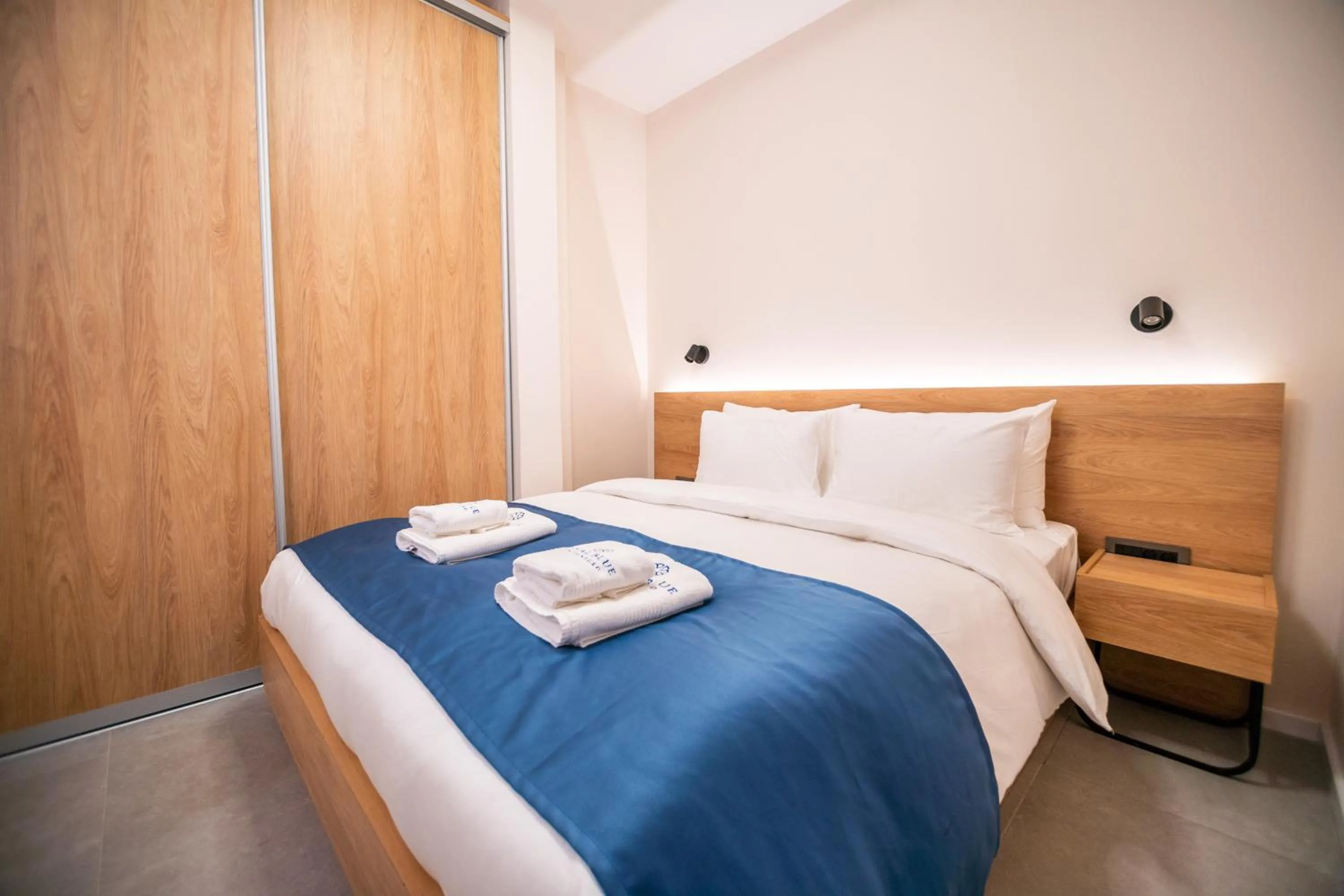 Bed in Royal Blue Resort & Residences