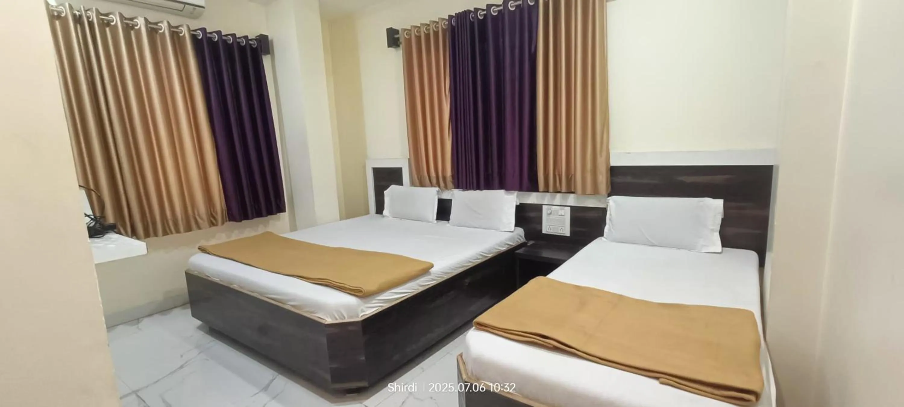 Bed in Hotel Sai viraj palace