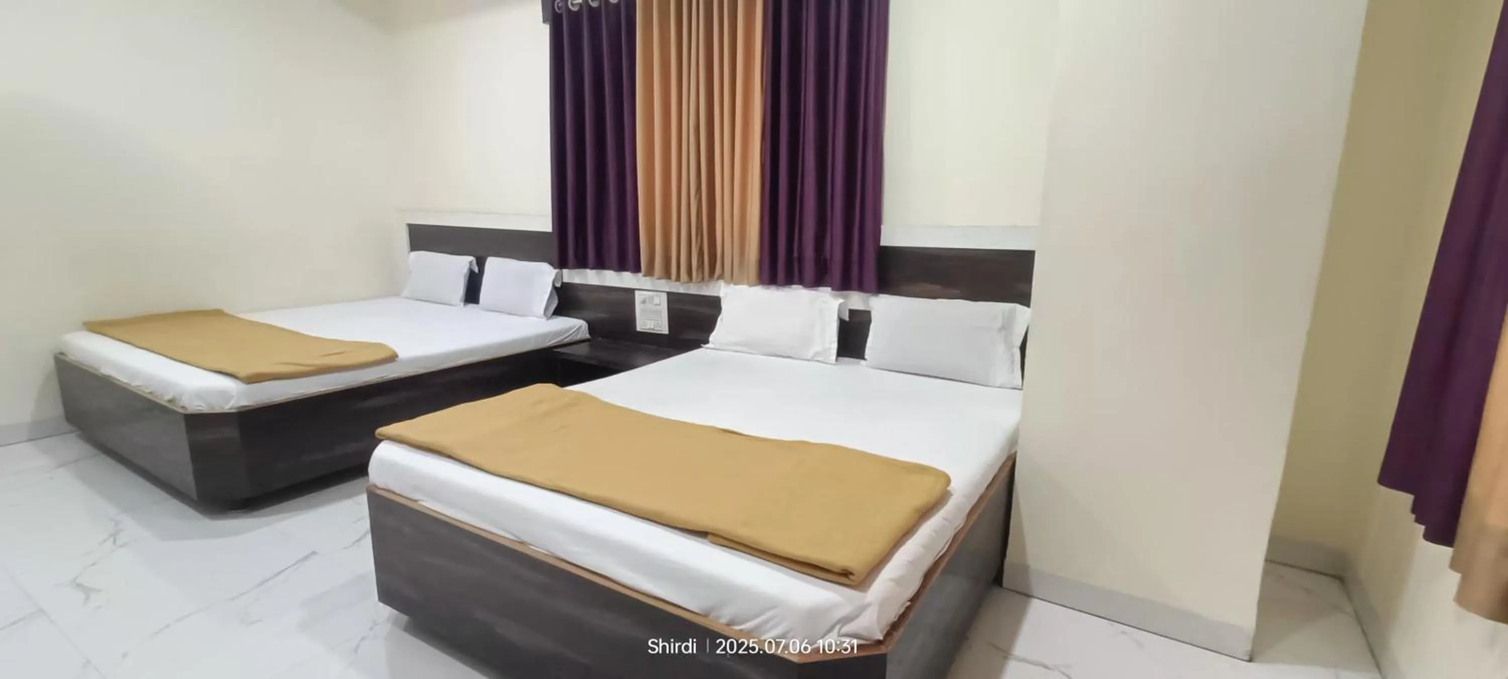 Bed in Hotel Sai viraj palace