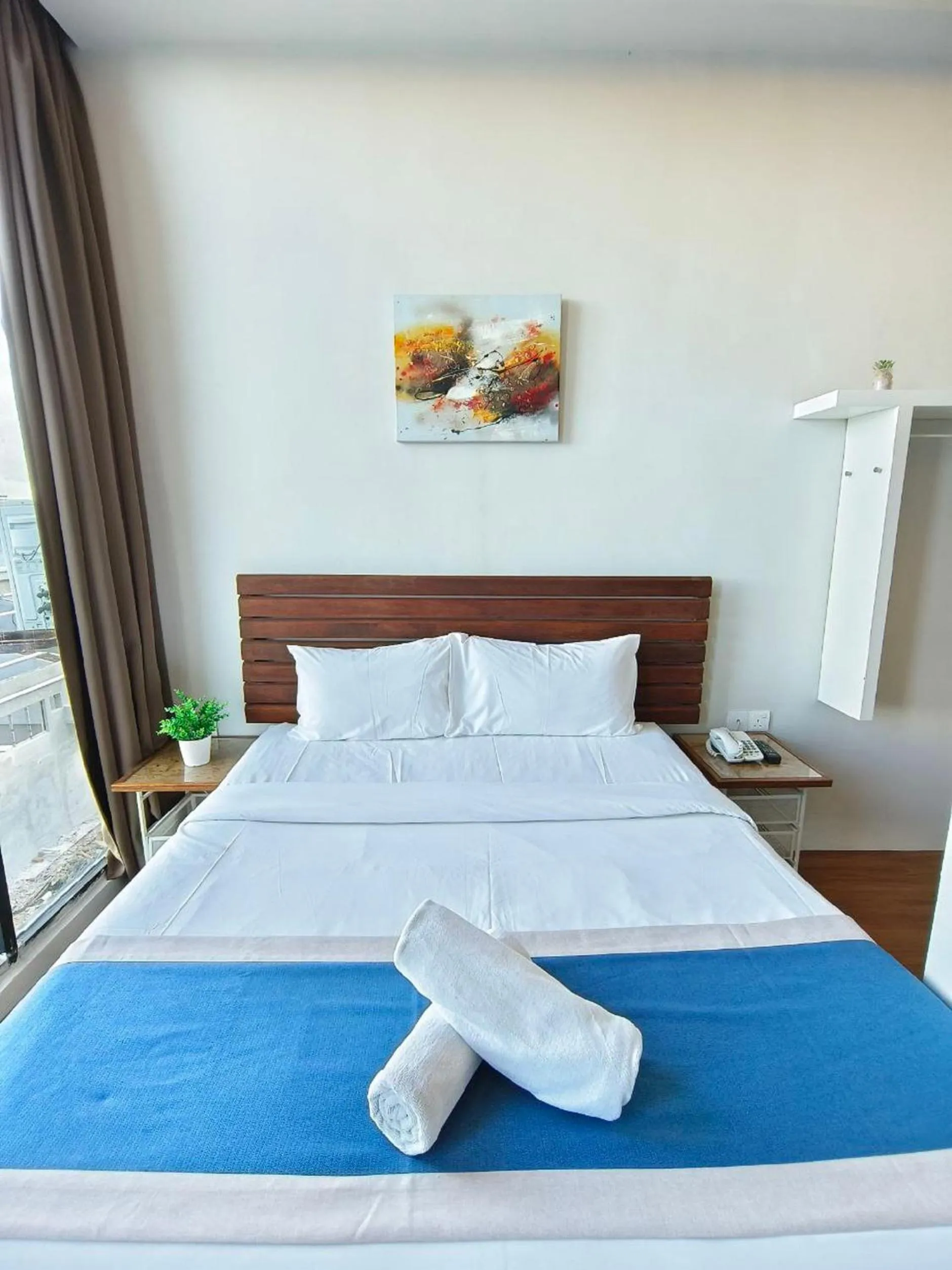 Bedroom, Bed in The Riverbank Hotel By MRVJ Business