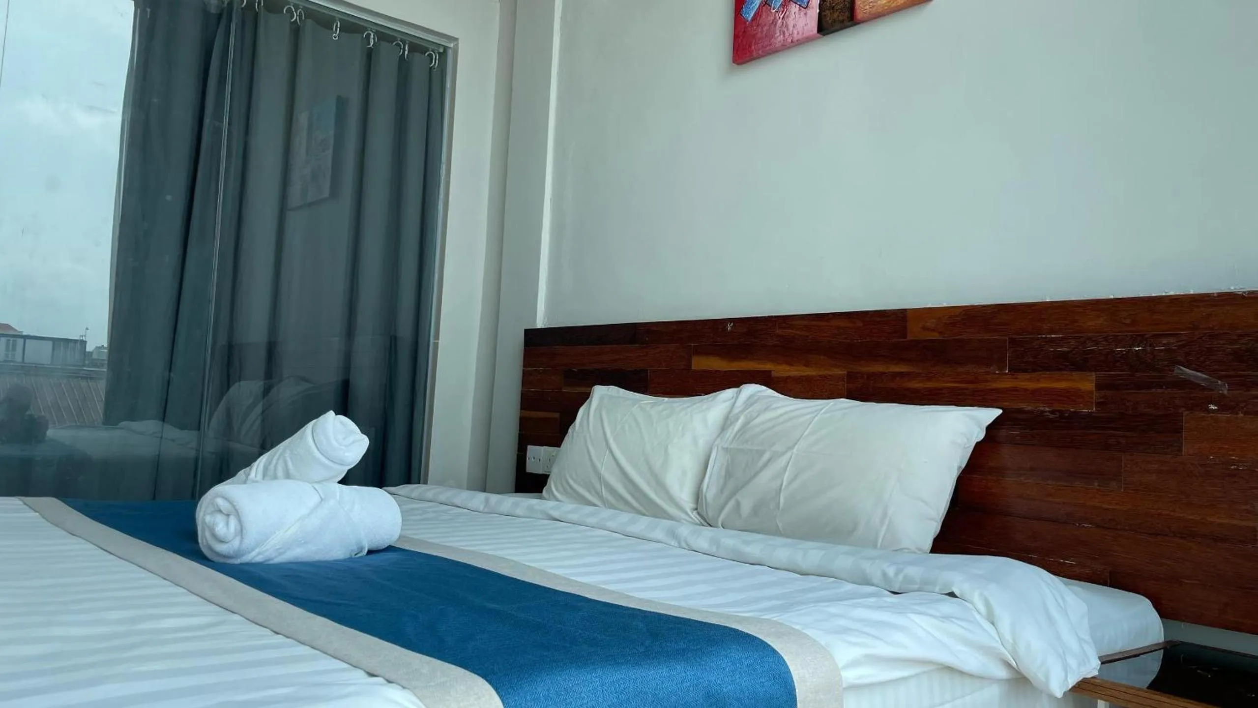 Bed in The Riverbank Hotel By MRVJ Business