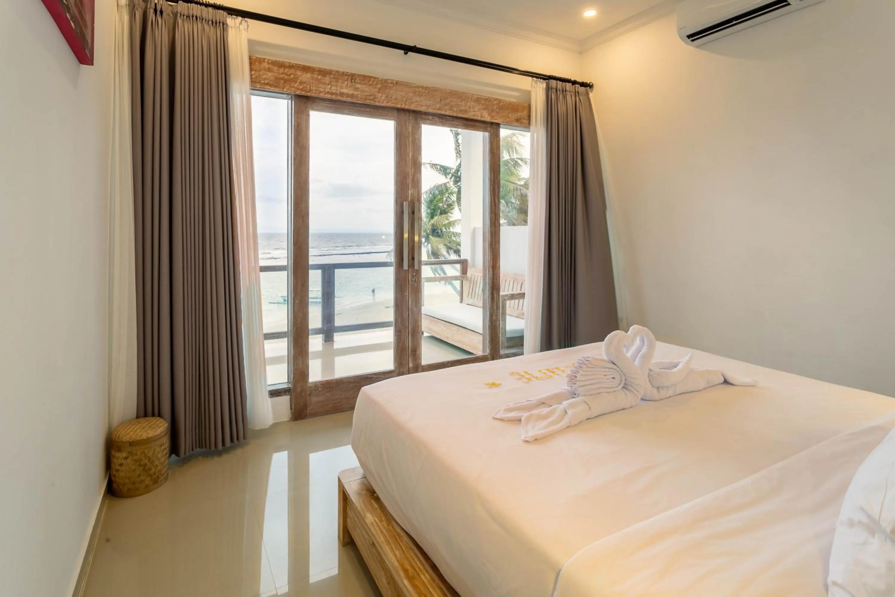 Bed in Utama Villas Beach Front Candidasa