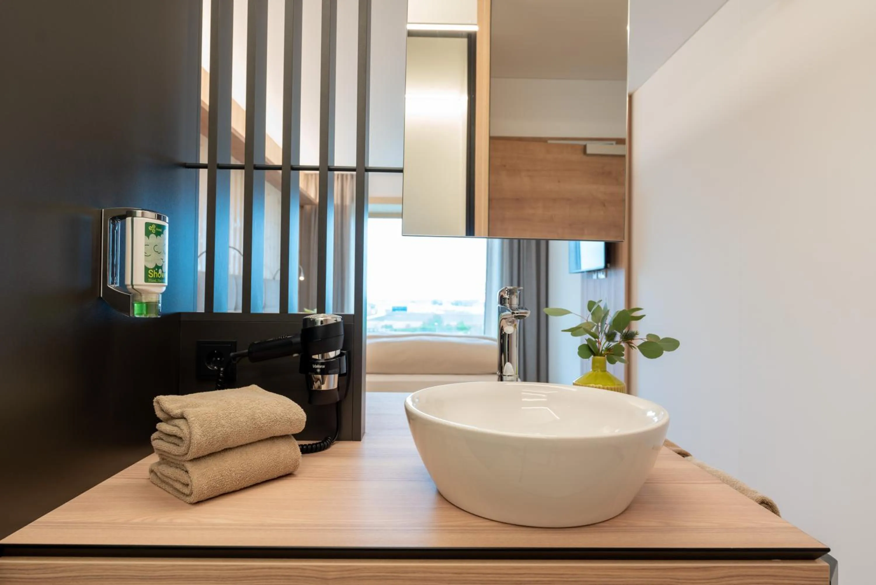 Bathroom, Bed in eee Hotel Eberstalzell