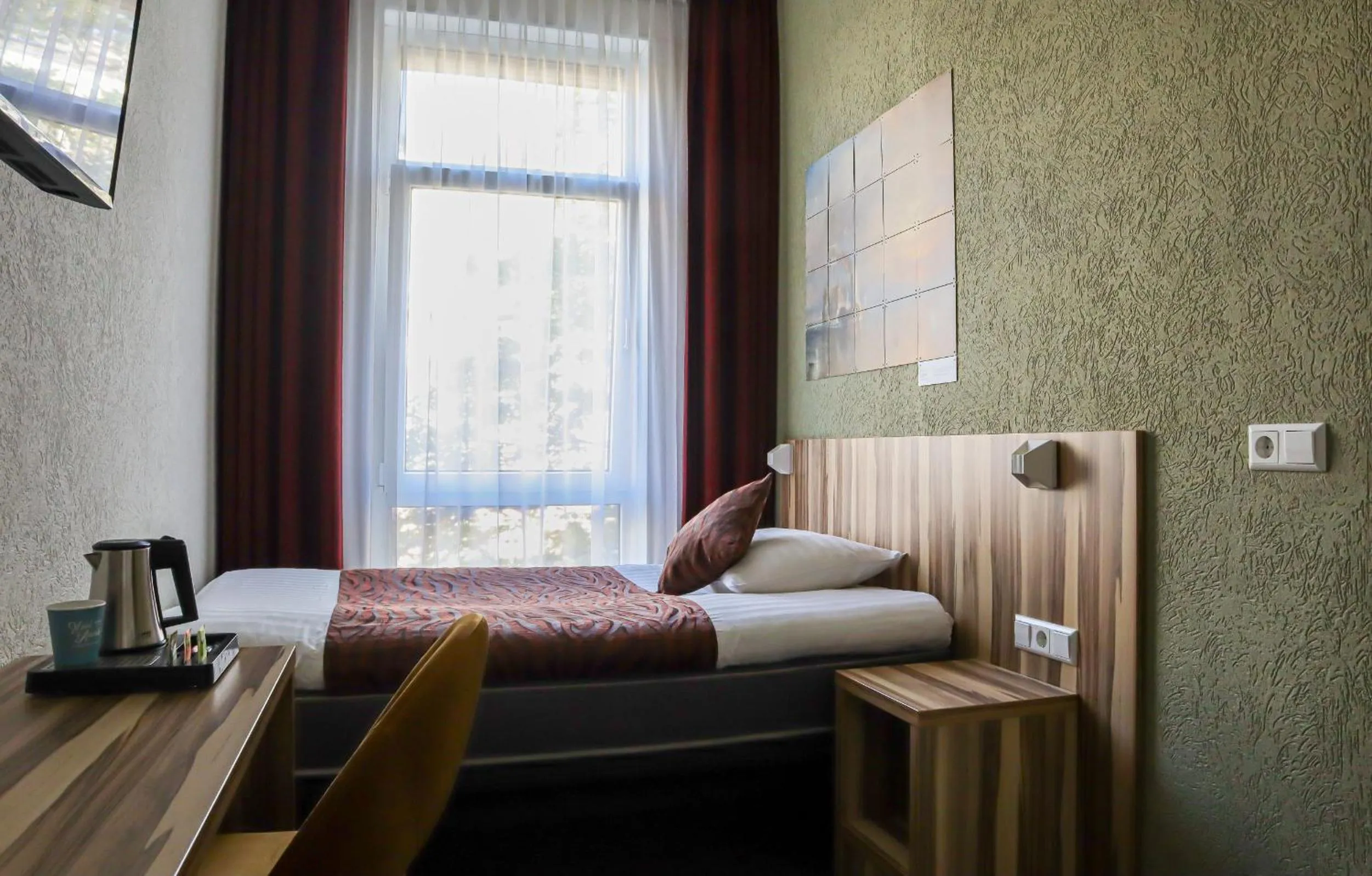 Property building, Bed in Hotel Asterisk, a family run hotel