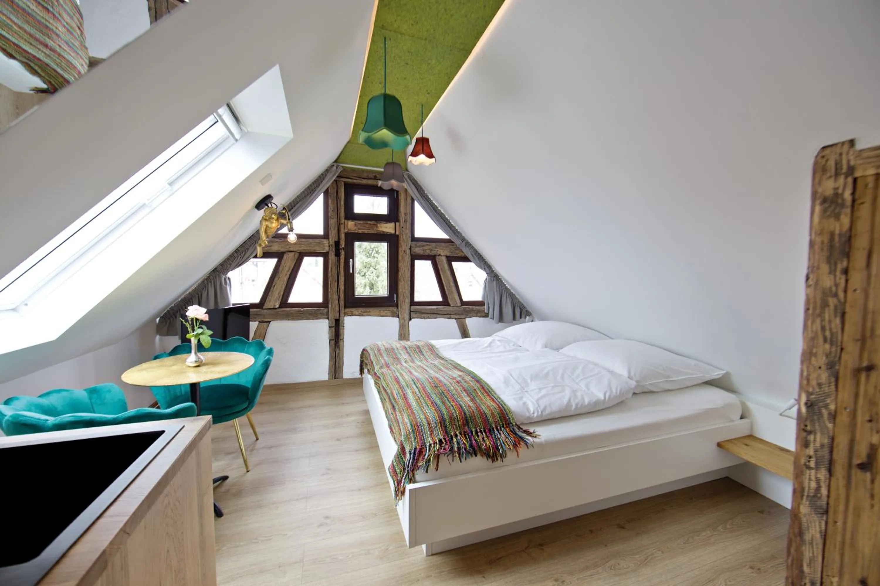 Living room, Bed in Zinsers Appartements im Flämmle