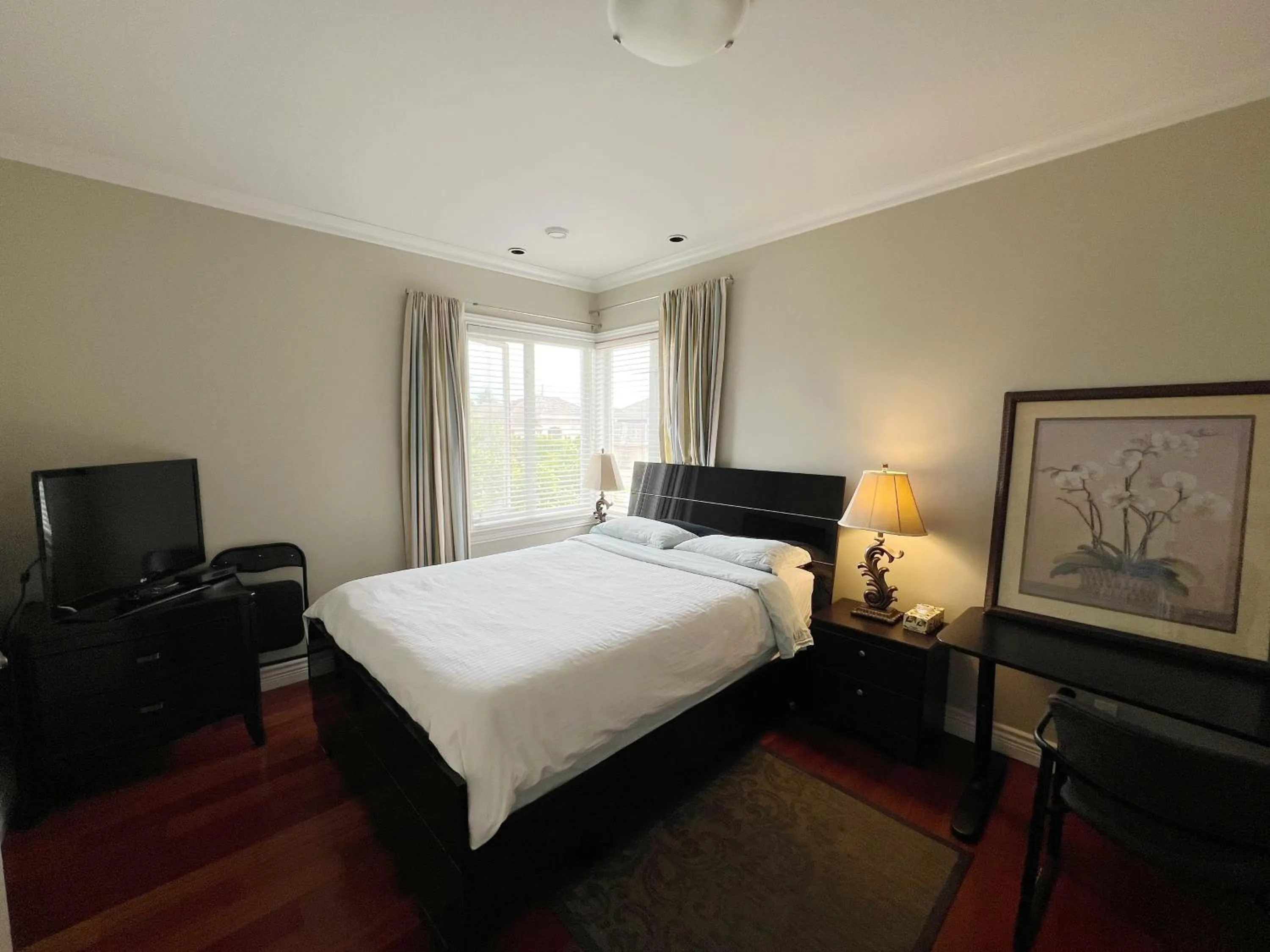 Bed in A cozy independent entrance bedroom with a private washroom close to YVR Richmond