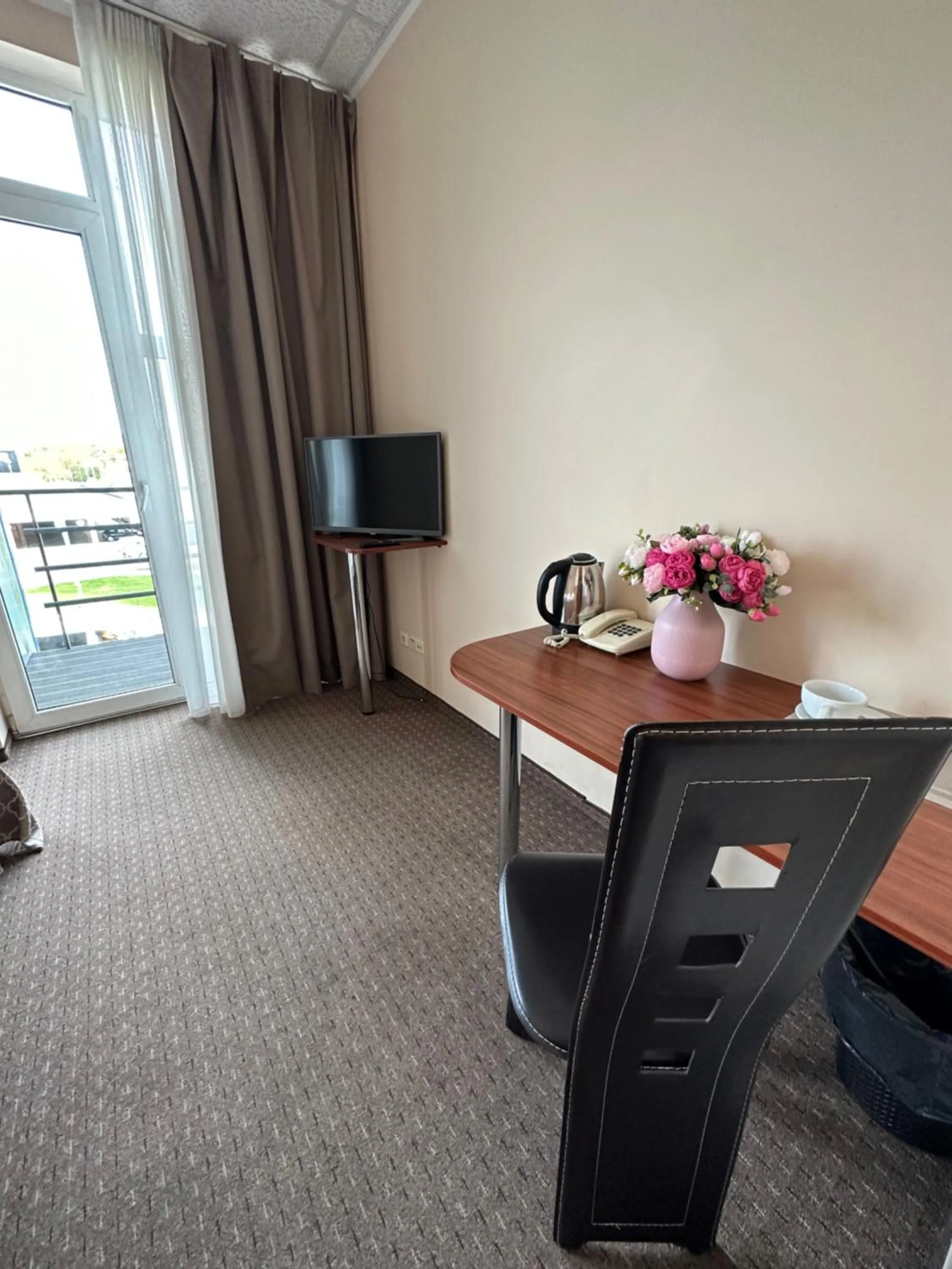 Communal lounge/ TV room in Riga Unimars Hotel