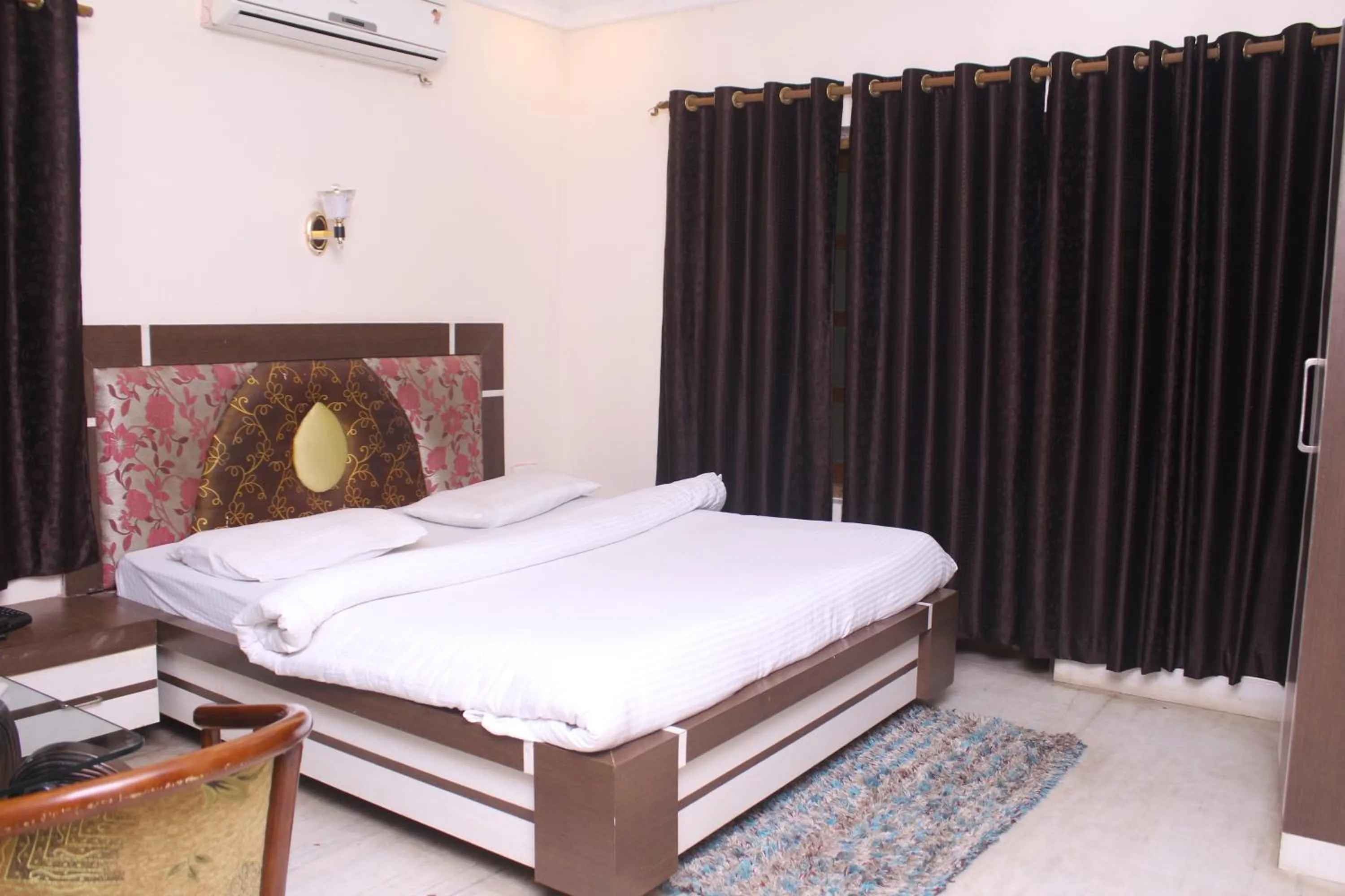 Bed in ROYAL CHETAN INN