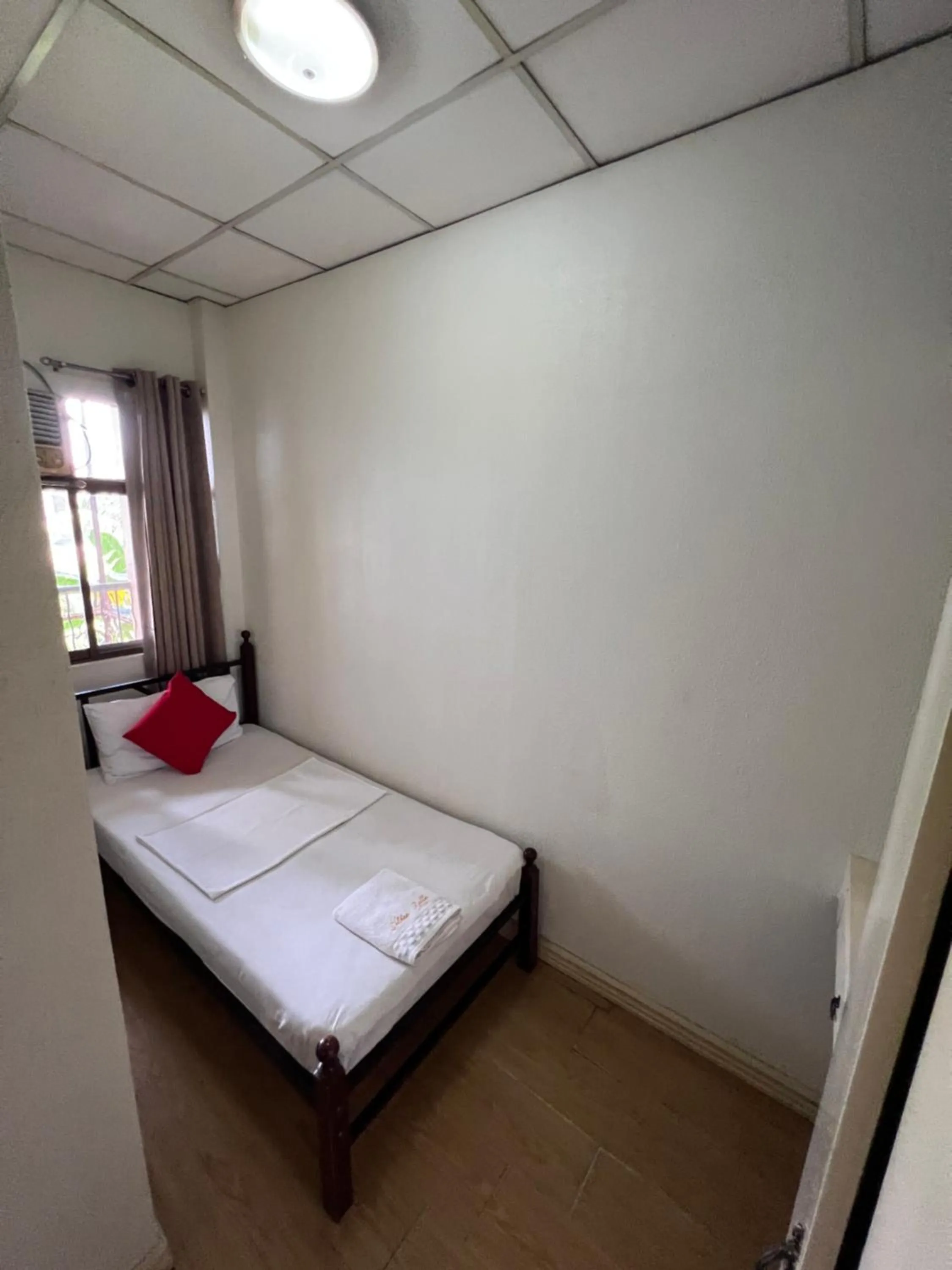 Bed in Golden Belle Apartelle and Suites