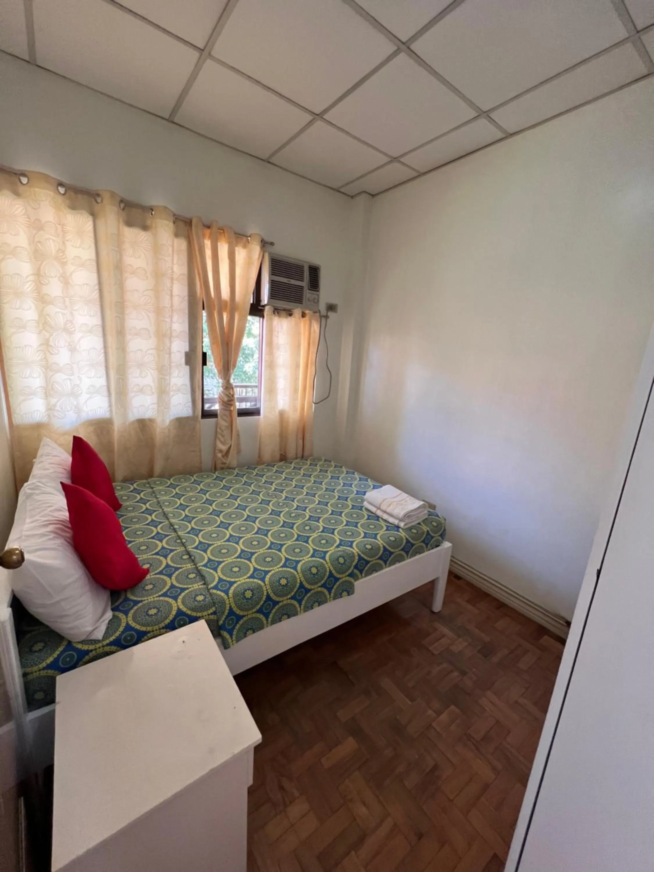 Bed in Golden Belle Apartelle and Suites