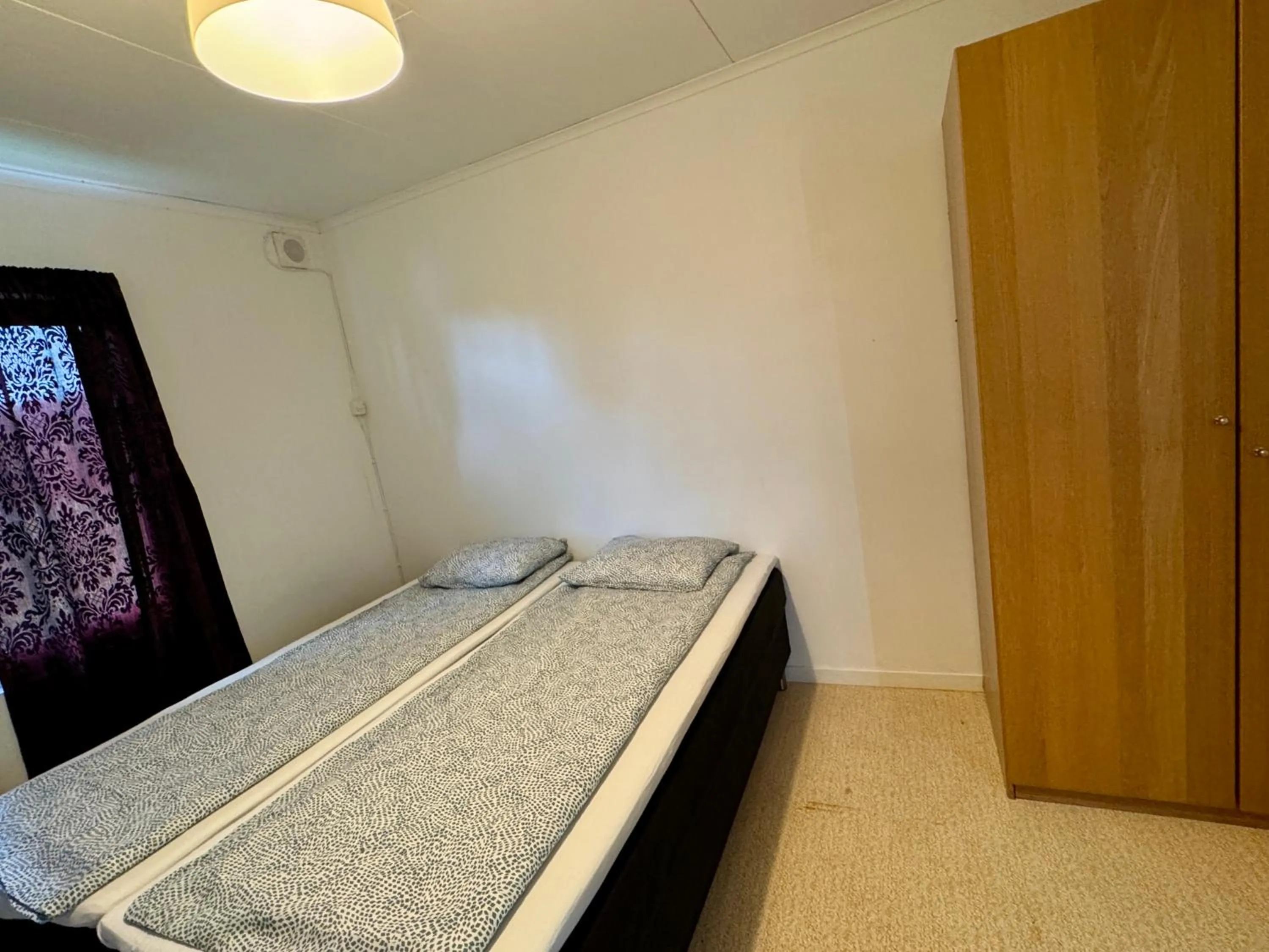 Bed in Hässlebogården Turist & Konferens