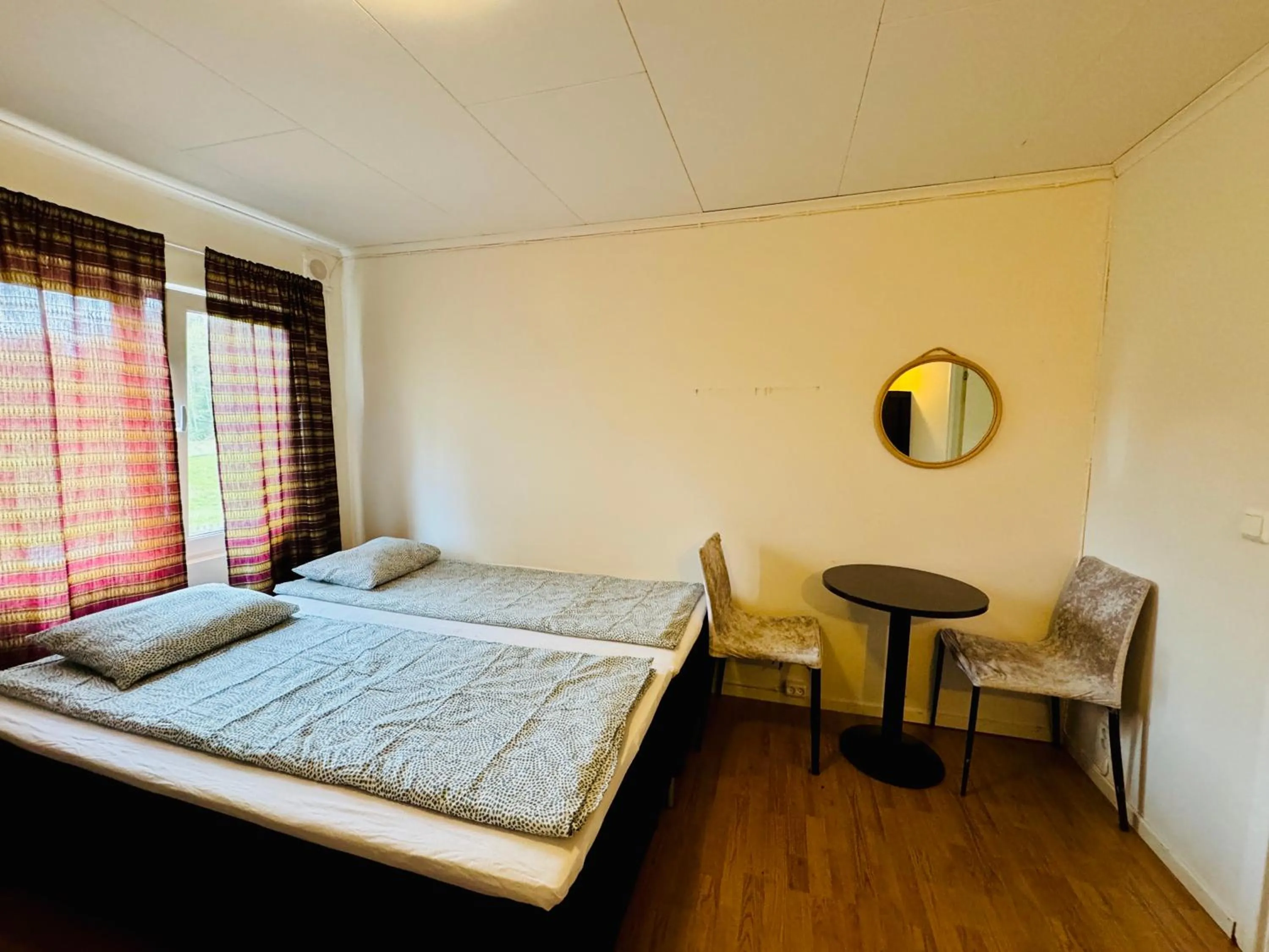 Bed in Hässlebogården Turist & Konferens