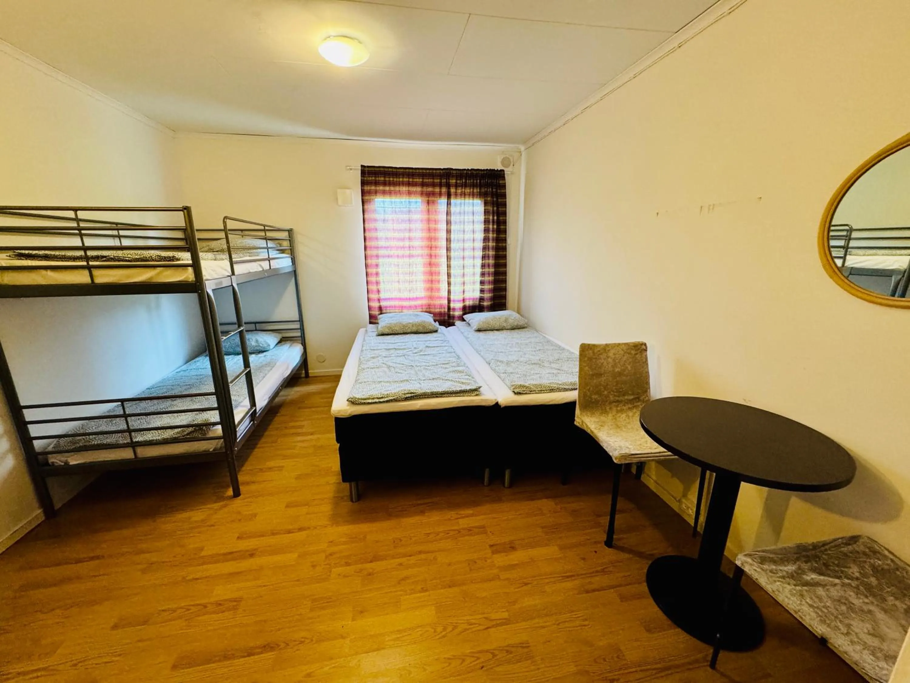 Bed in Hässlebogården Turist & Konferens