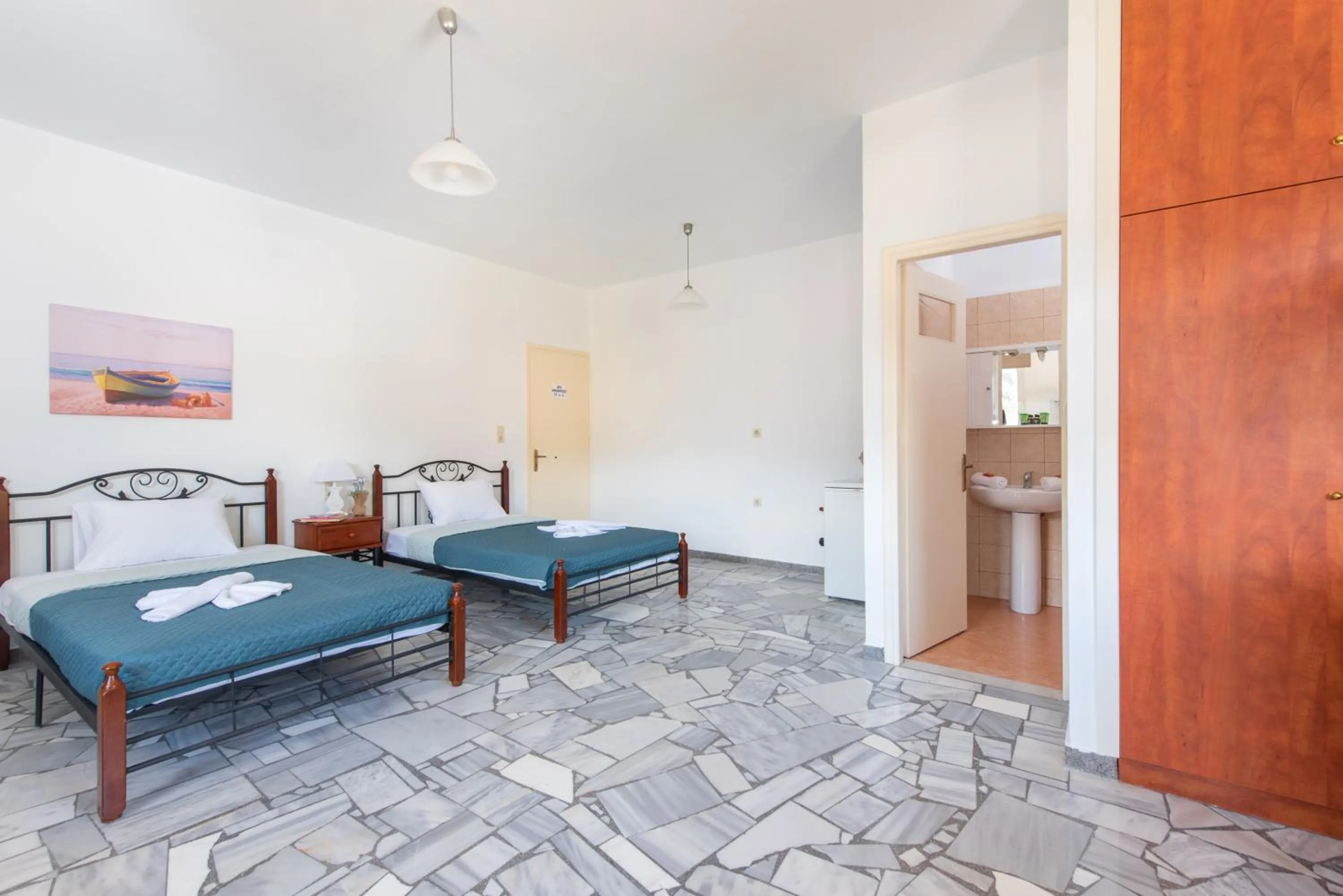 Bed in Almy Beach Hotel