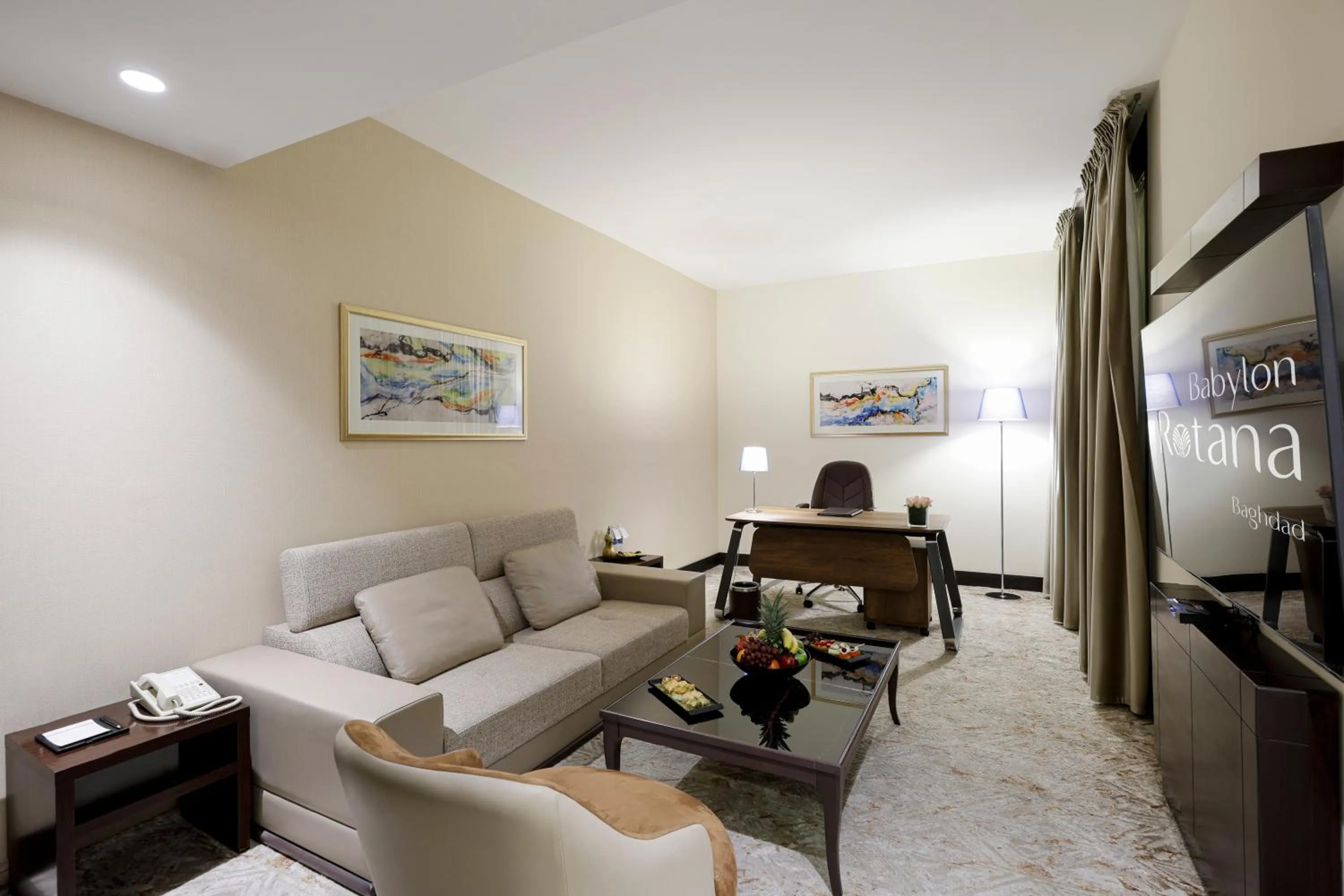 Communal lounge/ TV room in Babylon Rotana Hotel