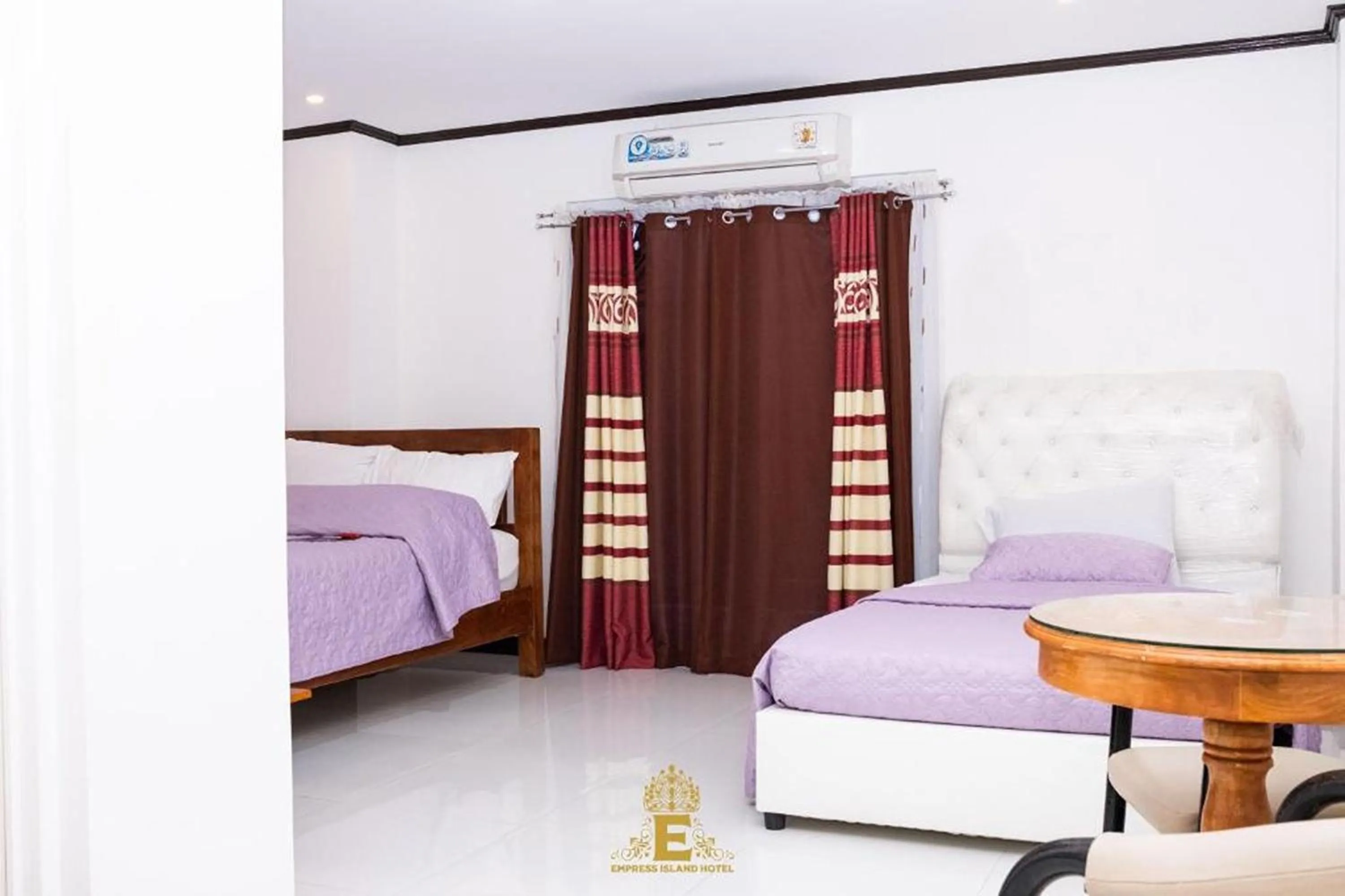 Bed in Empress Island Hotel