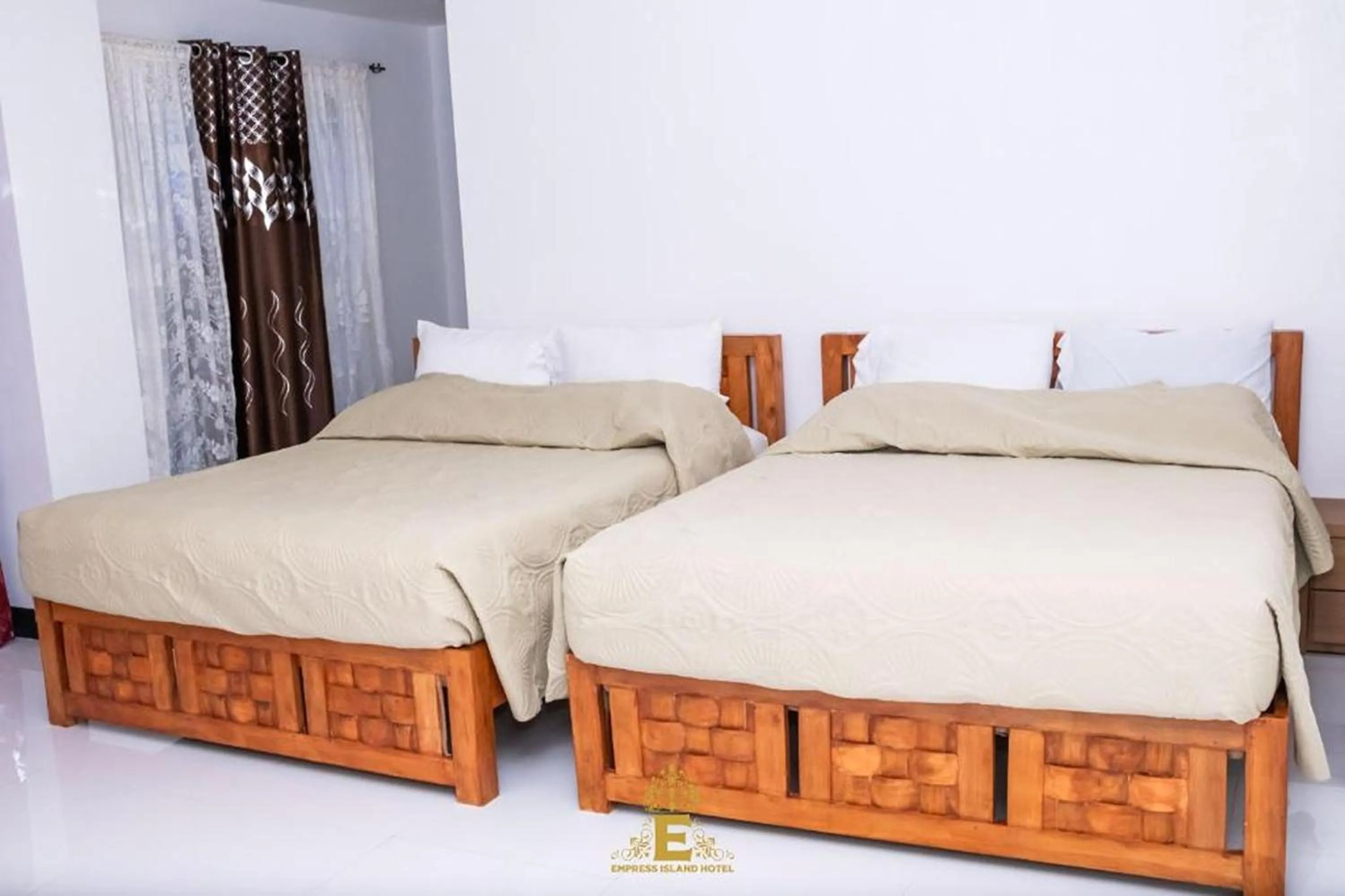 Bed in Empress Island Hotel
