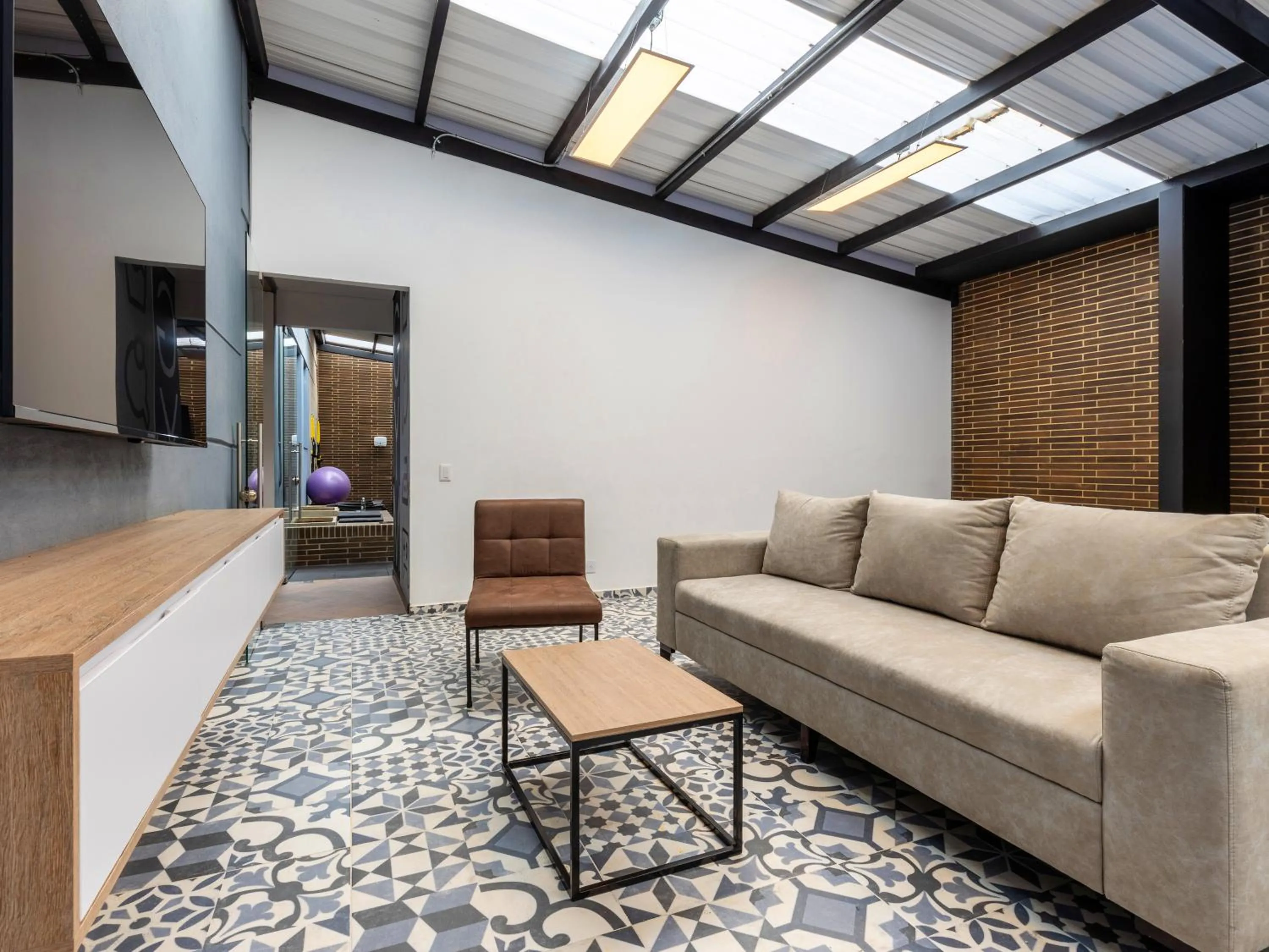 Living room in Beliving by Wynwood House