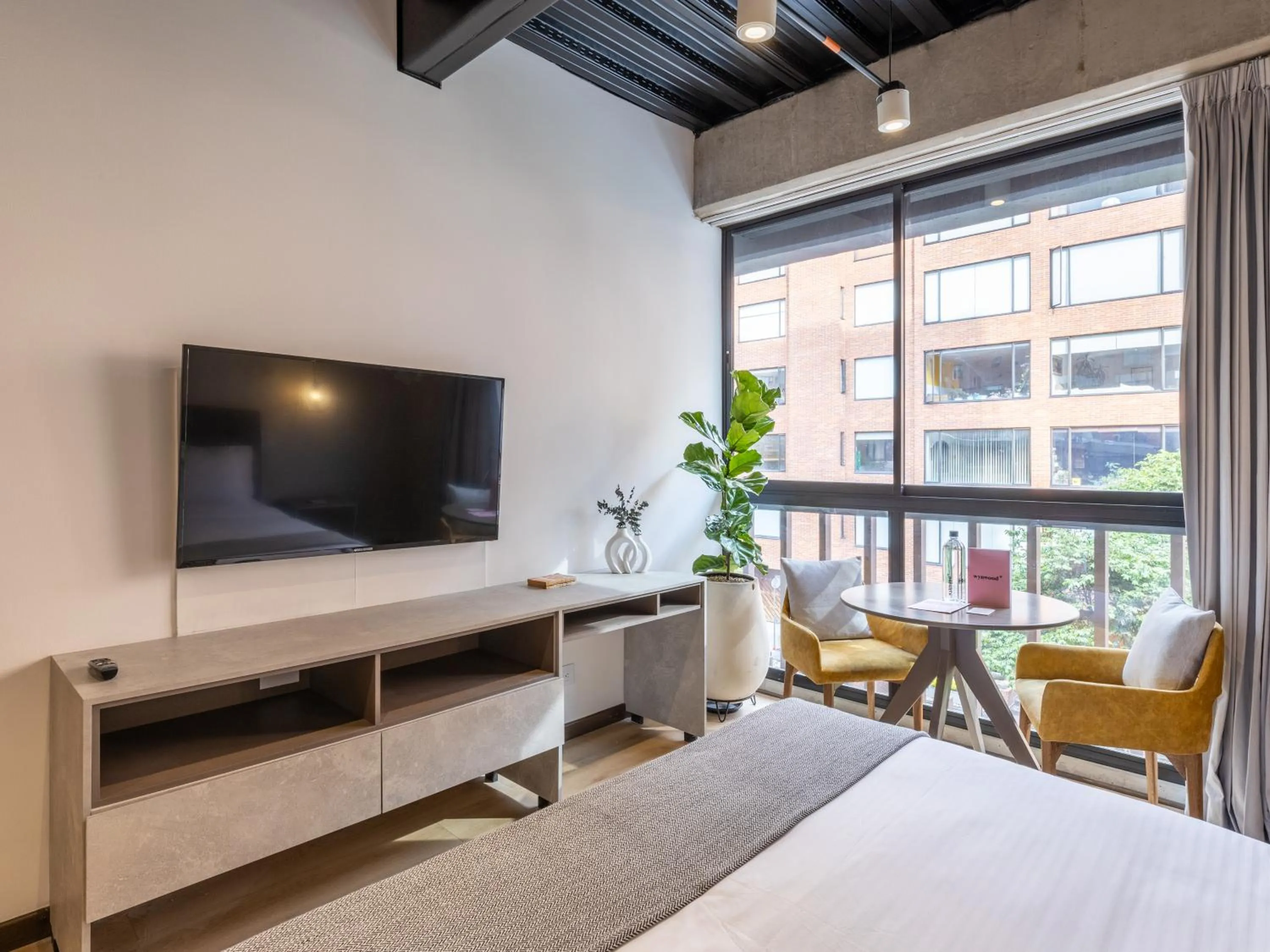 Photo of the whole room, Bed in Beliving by Wynwood House