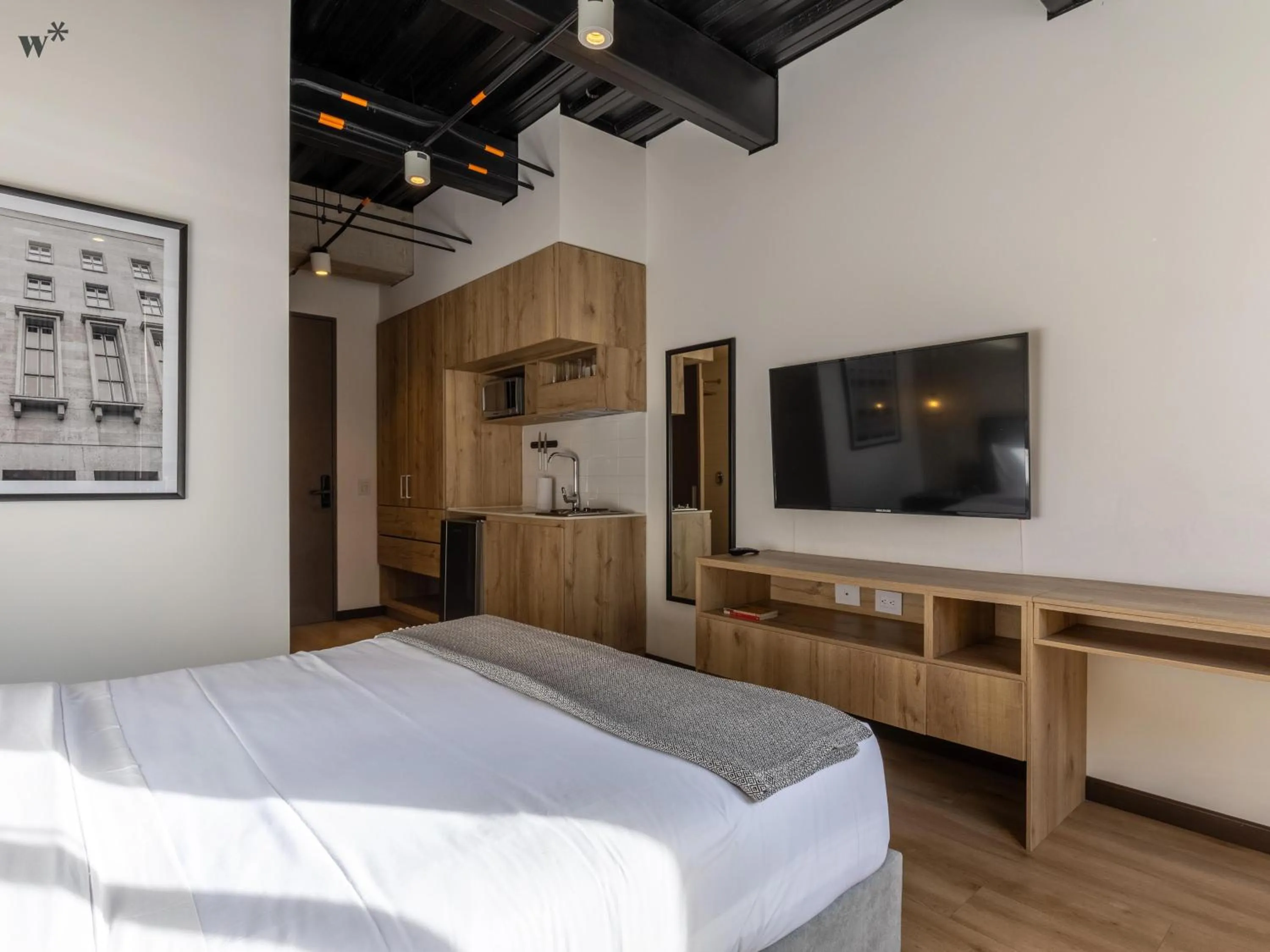 Bed in Beliving by Wynwood House