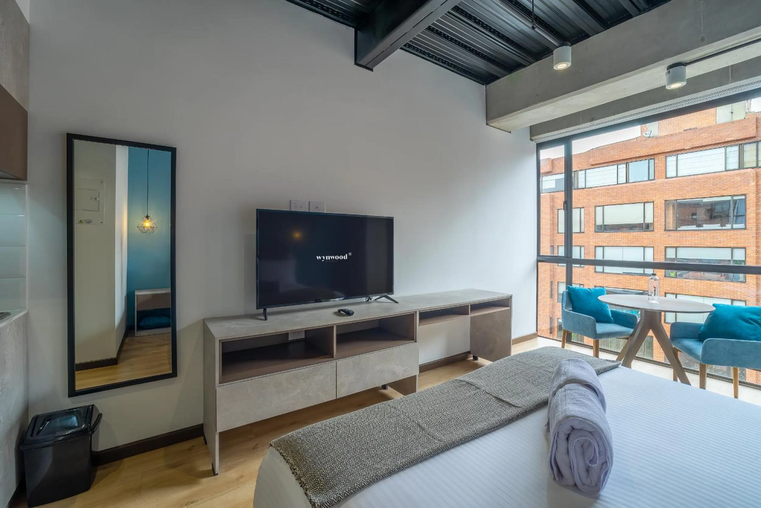 Bed in Beliving by Wynwood House