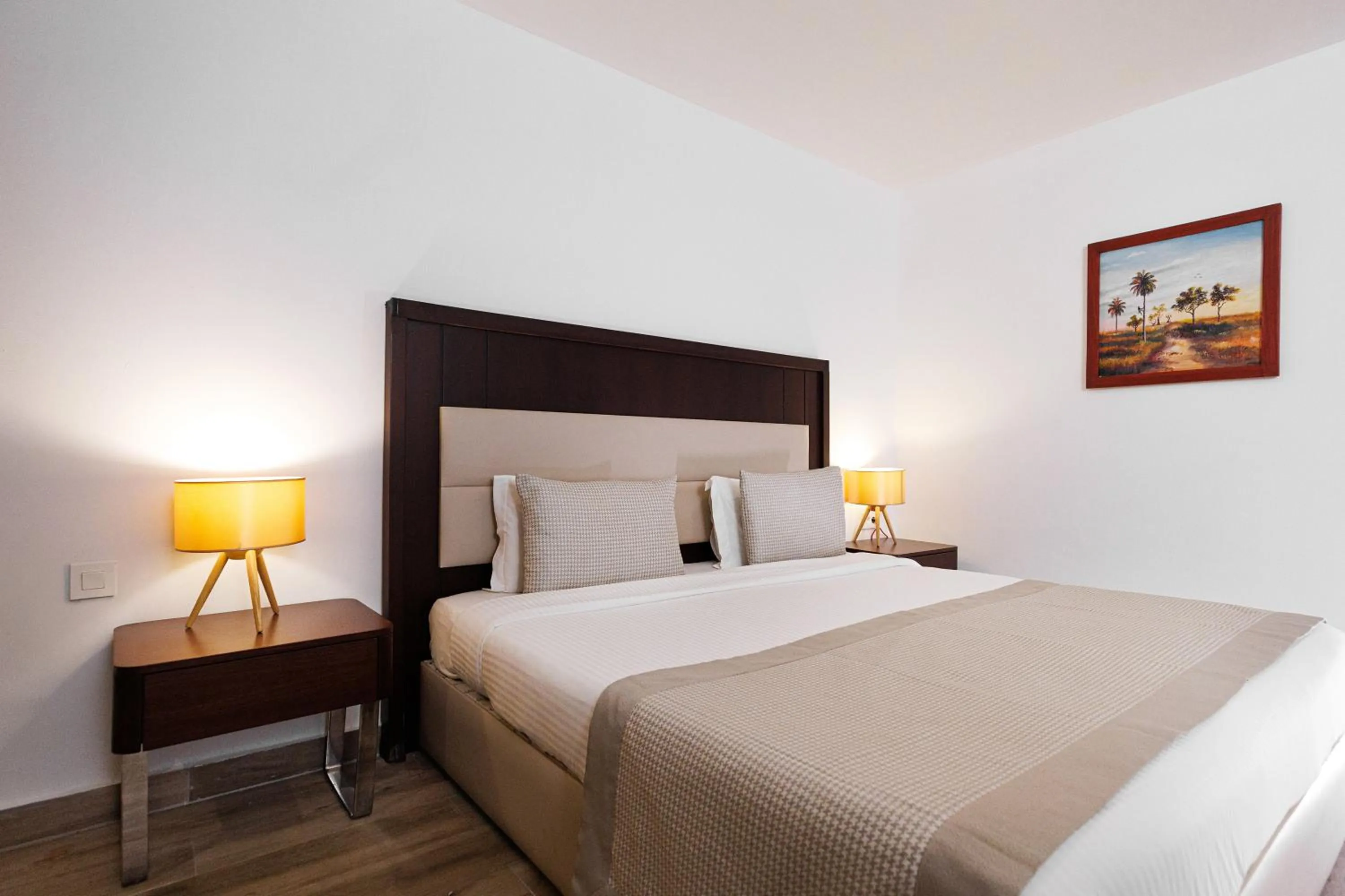 Bed in Riviera Royal Hotel