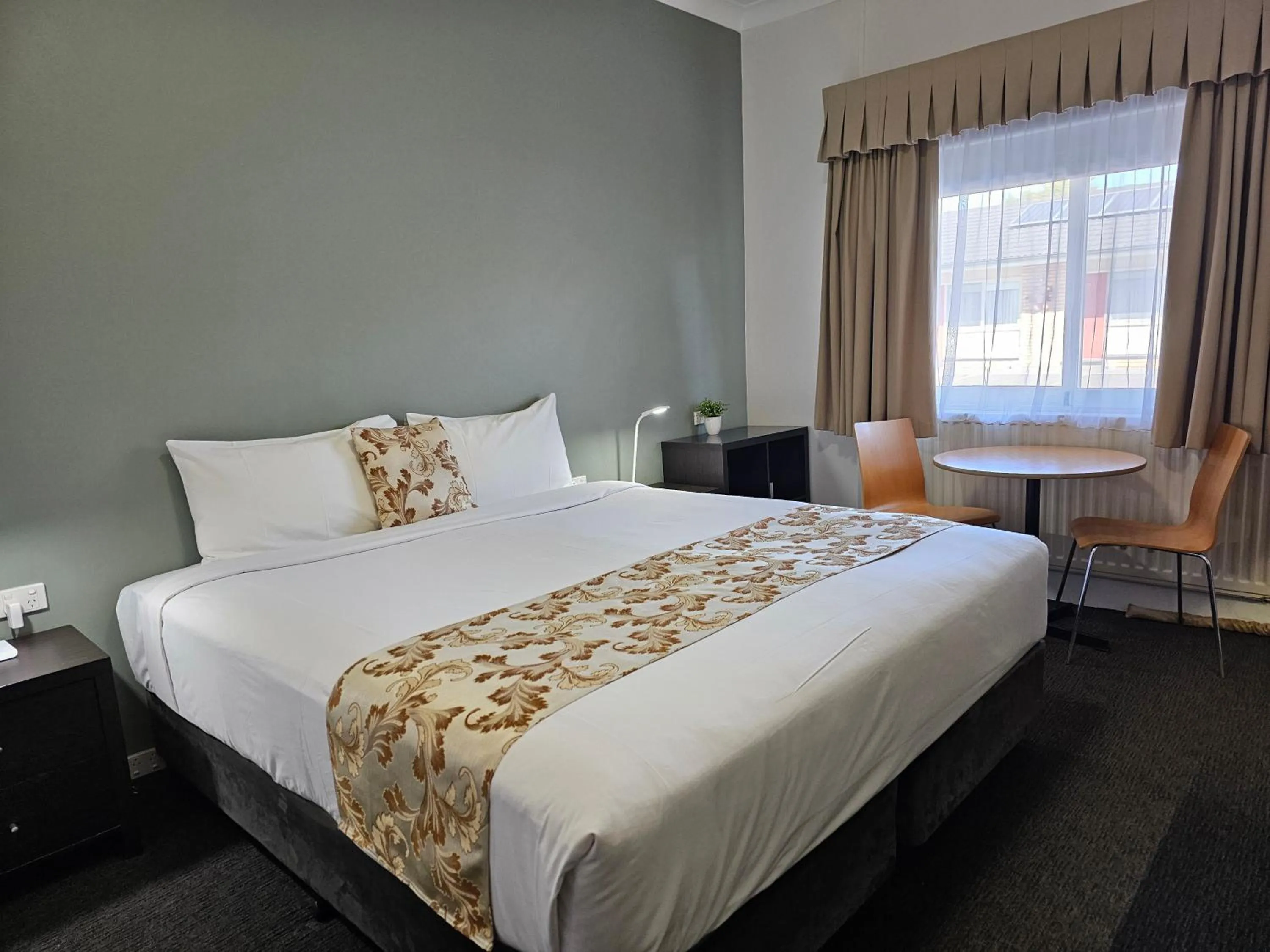 Bed in Country Lodge Motor Inn