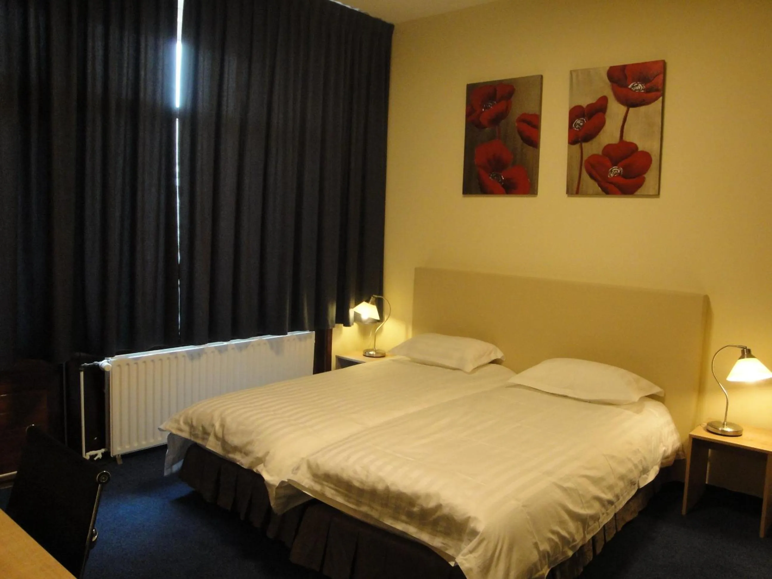 Bed in New City Hotel Scheveningen