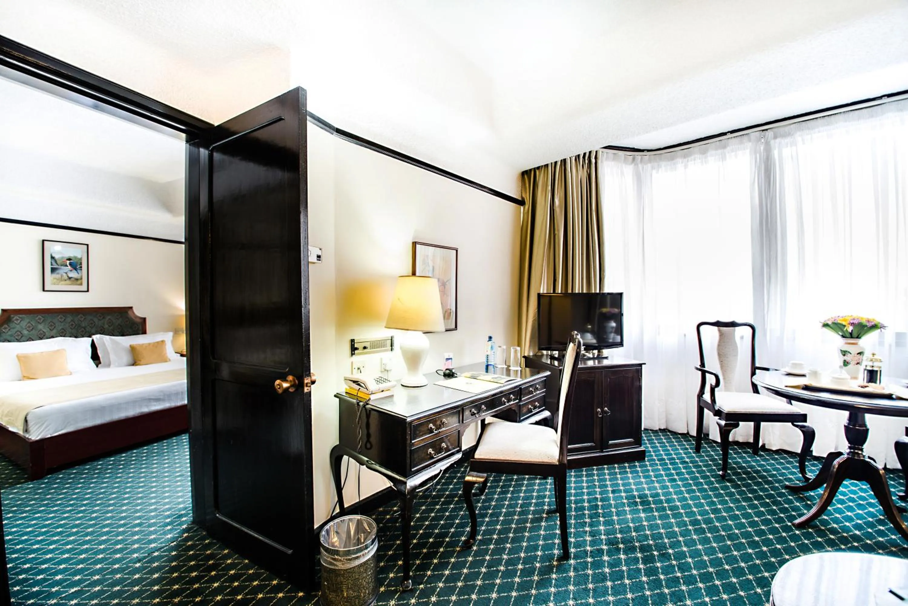 Living room, Bed in Nairobi Safari Club by Swiss-Belhotel