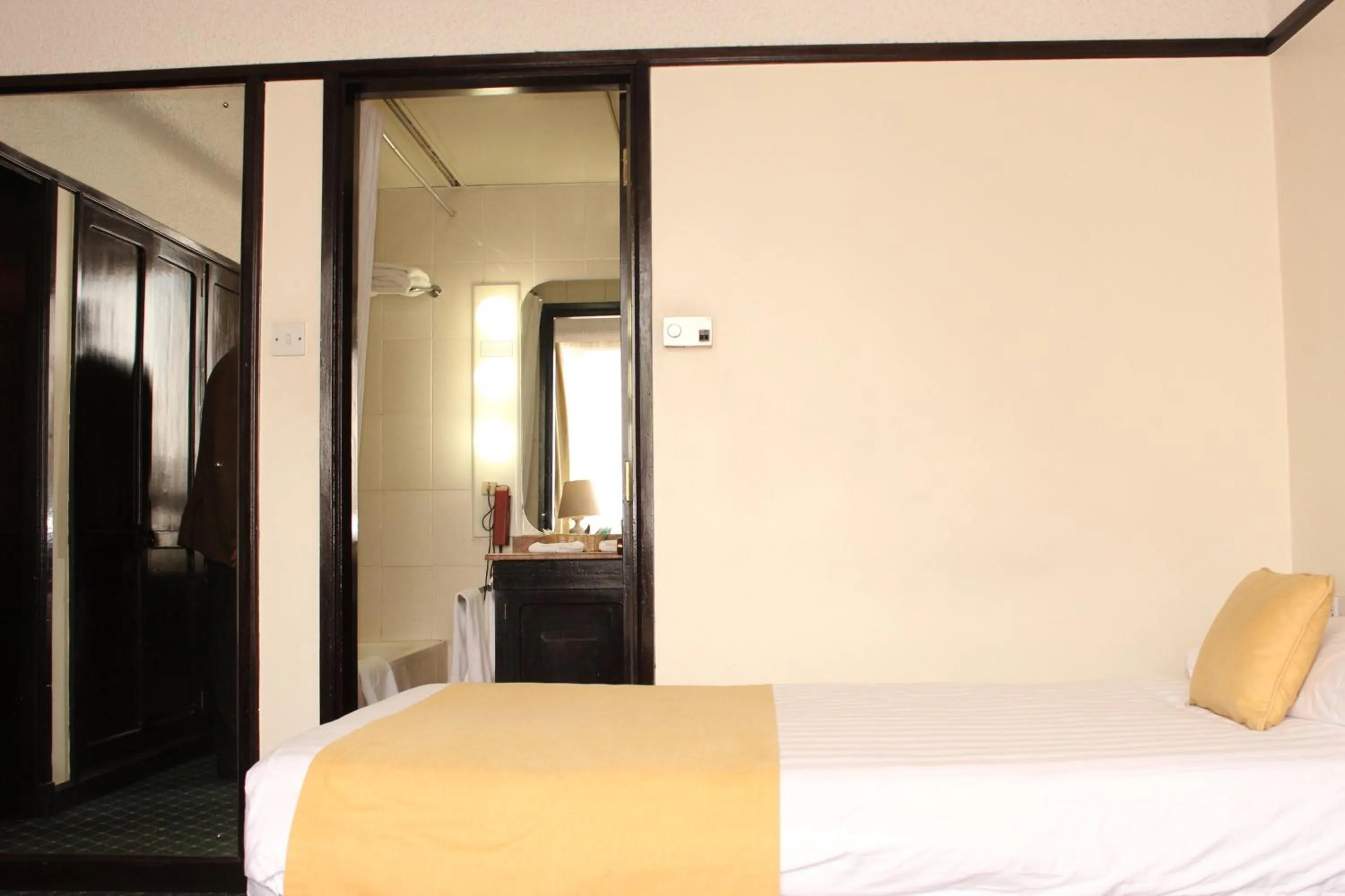 Bed in Nairobi Safari Club by Swiss-Belhotel