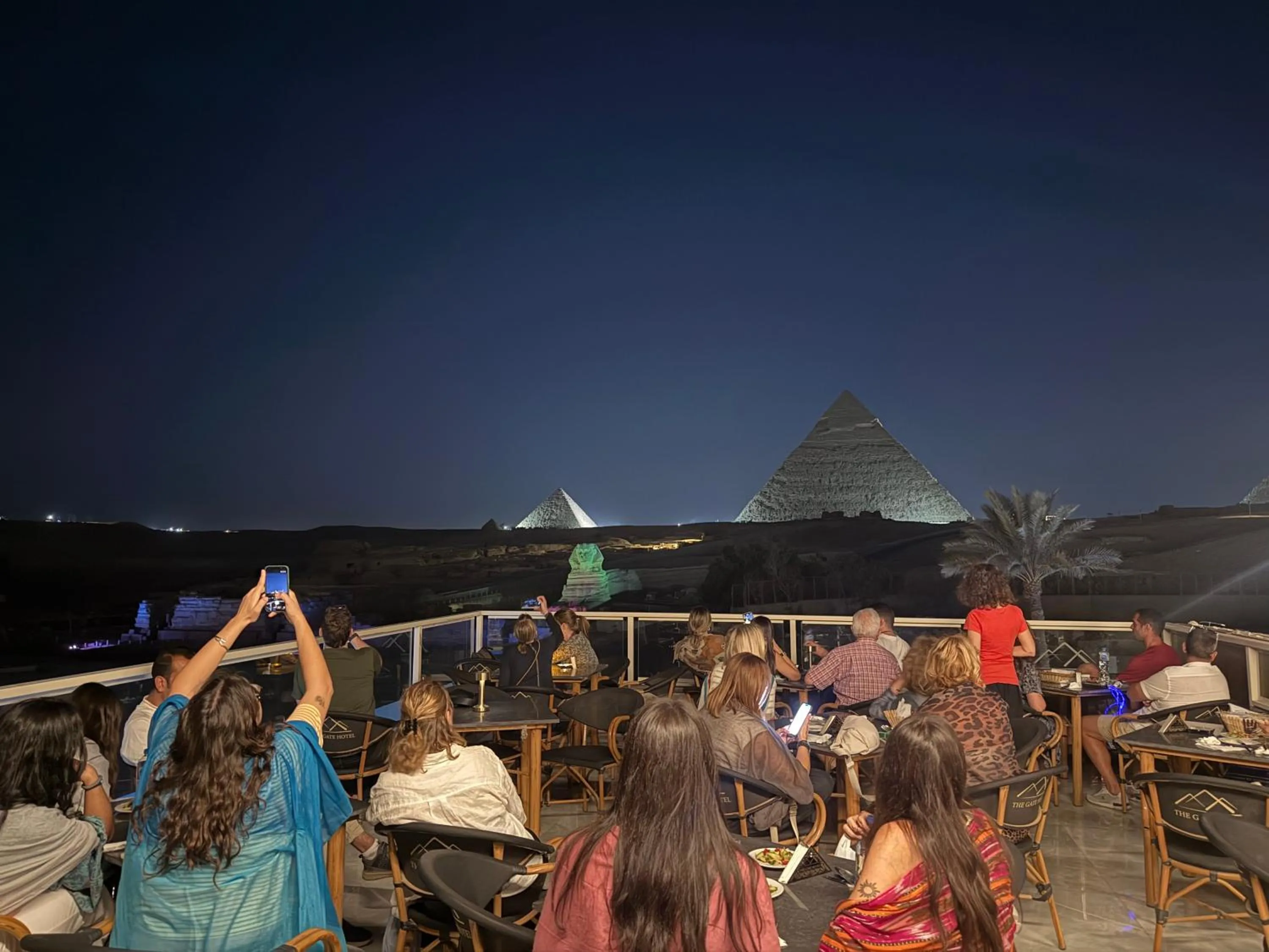 group of guests in The Gate Hotel Front Pyramids & Sphinx View