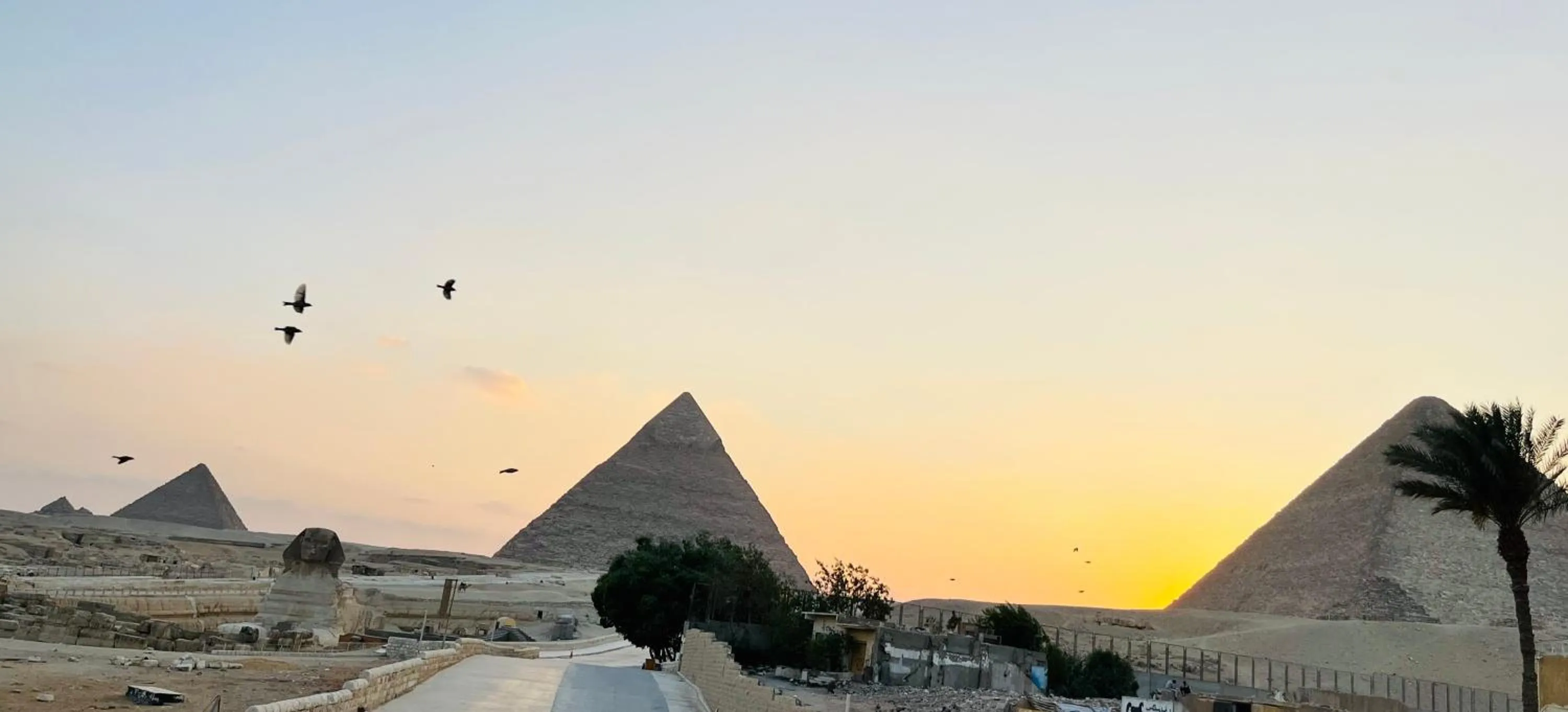 Sunrise in The Gate Hotel Front Pyramids & Sphinx View