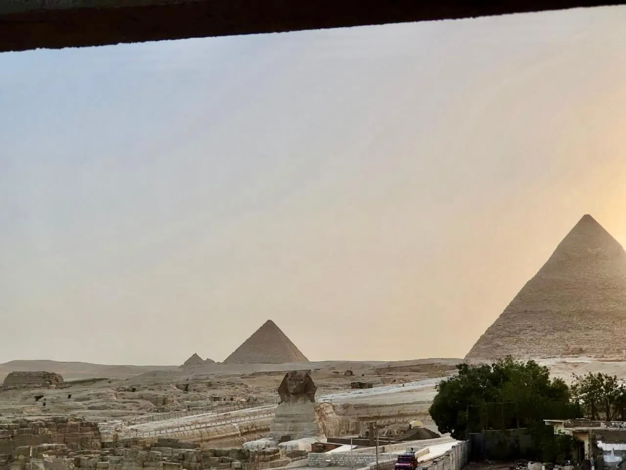 Sunset in The Gate Hotel Front Pyramids & Sphinx View