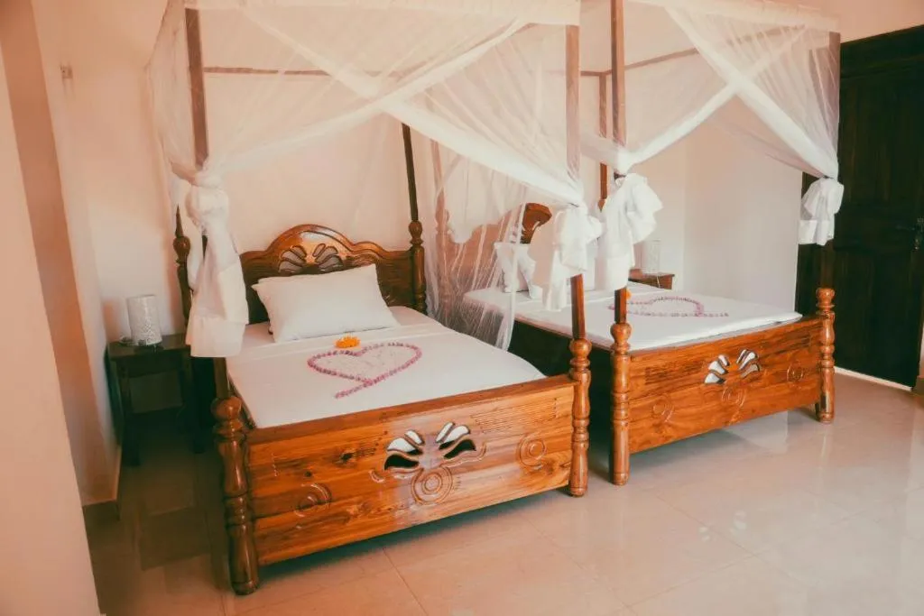 Bed in The Villa of Zanzibar