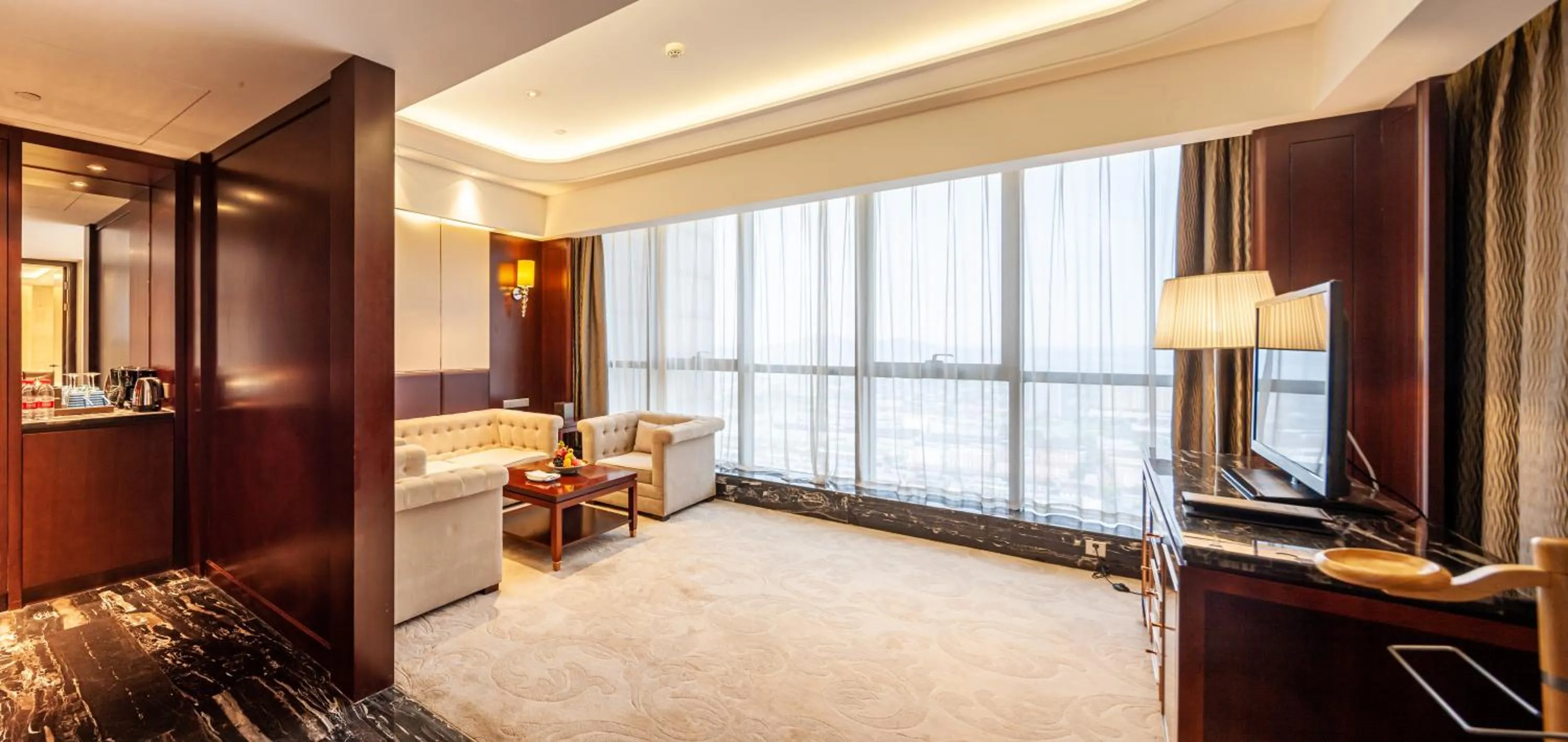Living room, Bed in Wyndham Grand Plaza Royale Changsheng Jiangyin