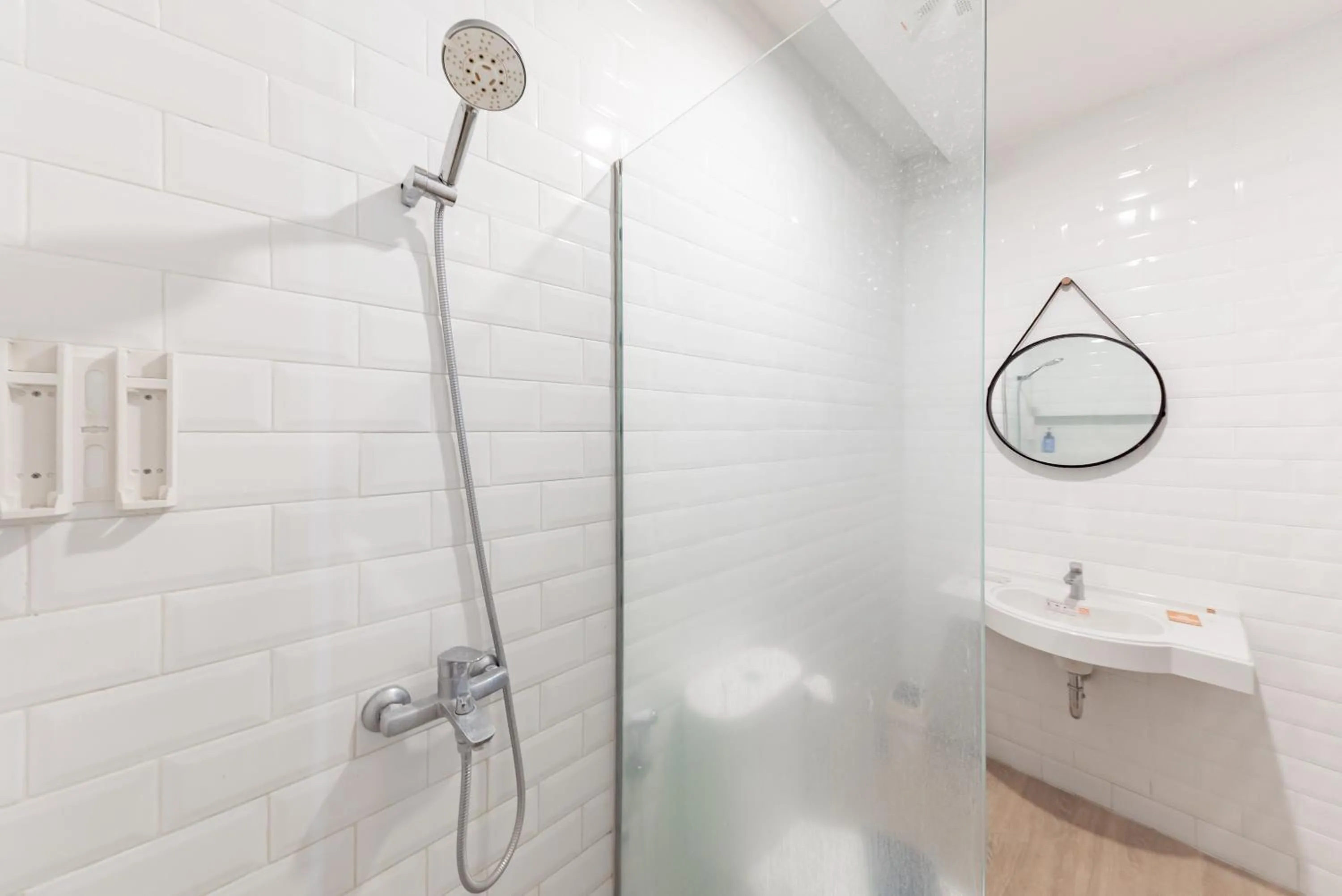 Bathroom in Sans Hotel Bobosini Malang by RedDoorz