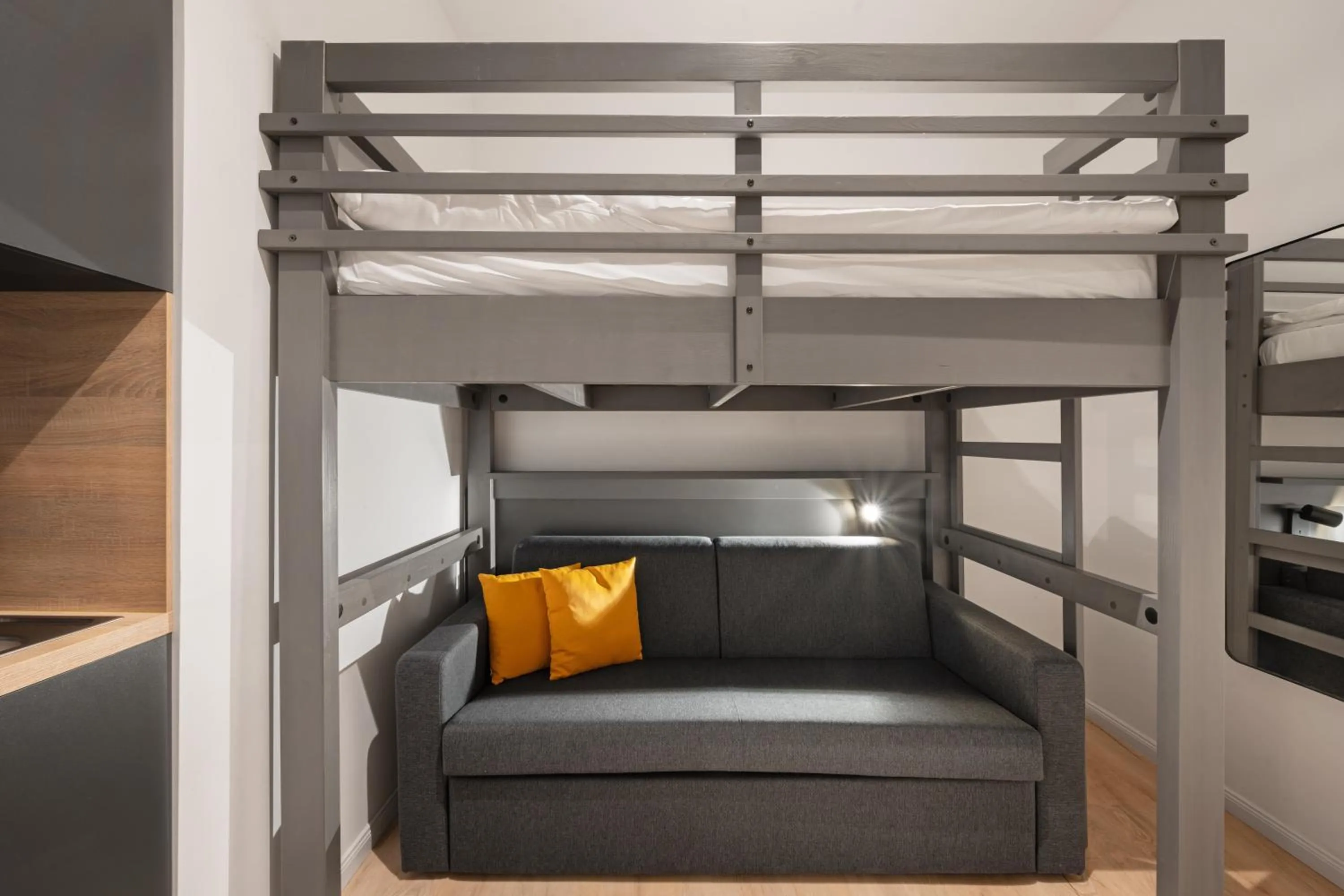 Bed in Servus Apartments by Homaris