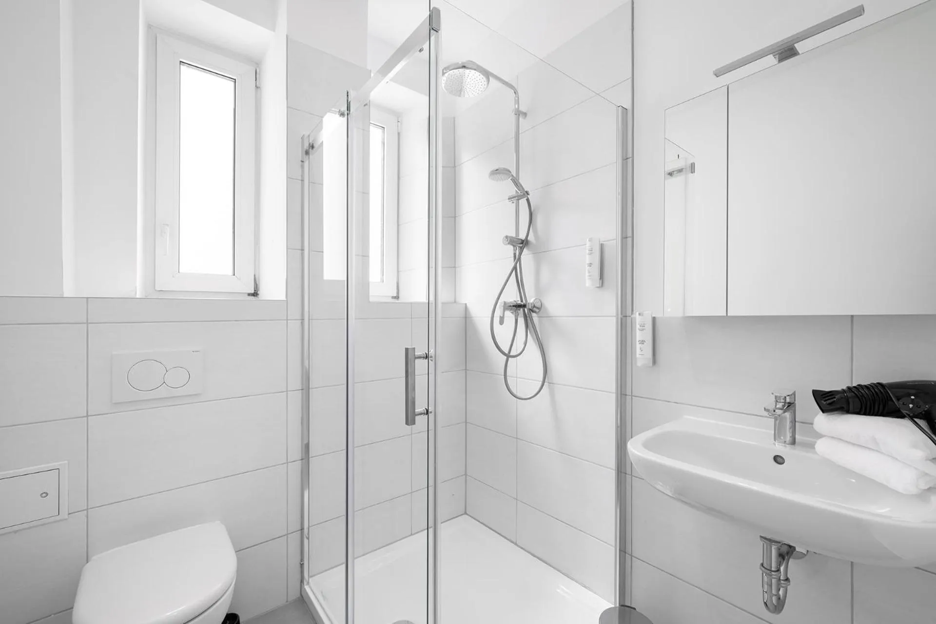 Bathroom in Servus Apartments by Homaris